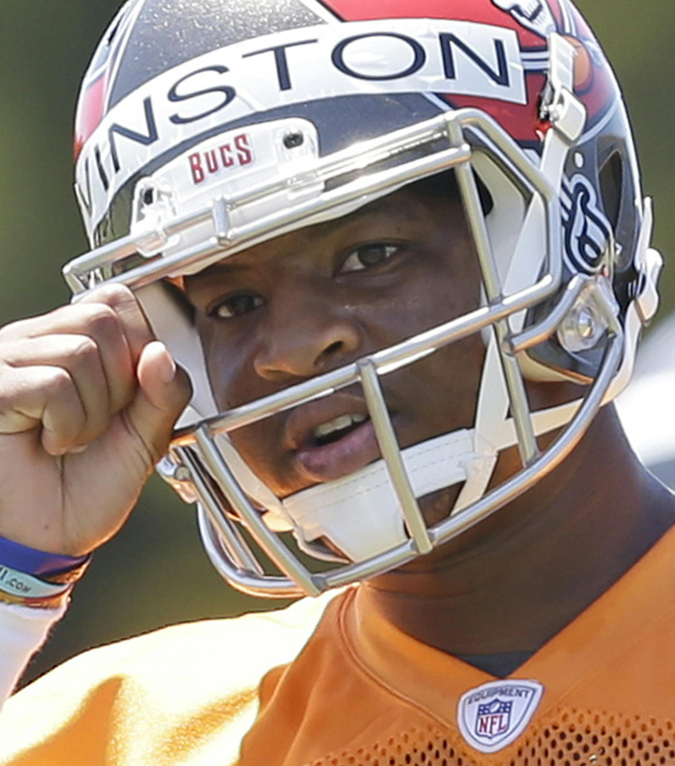 Tampa Bay Buccaneers quarterback Jameis Winston calls out a play during drills in an NFL rookie minicamp in Tampa, Fla., Friday, May 8, 2015. (AP Photo/Wilfredo Lee)