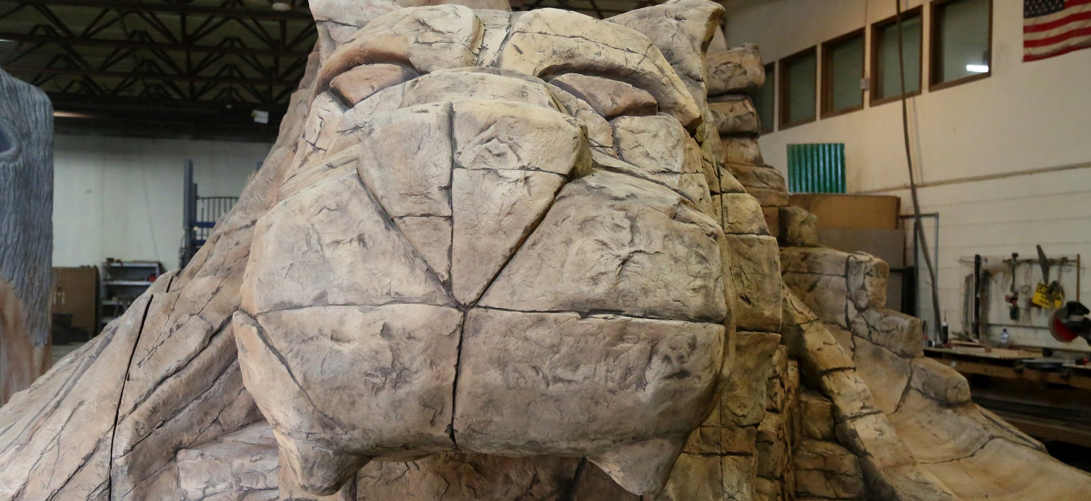 Themed Concepts, a Forest Lake business that builds and installs fiber reinforced concete playground equipment for businesses, theme parks and water parks nationally and internationally, recently completed this 25,000 pound mountain lion. The sculpture, made of rebar, structural steel and glass fiber reinforced concrete was seen at the plant Thursday, Feb. 19, 2015 in Forest Lake, MN and will be trucked to Phoenix, AZ, to go in a park as a playground.](DAVID JOLES/STARTRIBUNE)djoles@startribune.