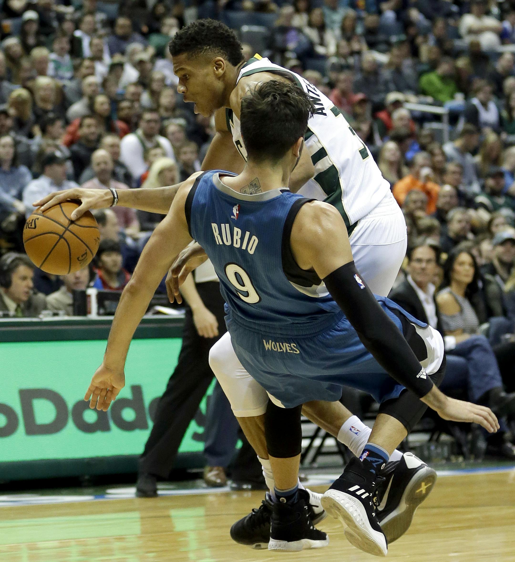 Milwaukee Bucks' Giannis Antetokounmpo is fouled by Minnesota Timberwolves' Ricky Rubio (9) on a drive to the basket during the second half of an NBA basketball game Saturday, March 11, 2017, in Milwaukee. (AP Photo/Aaron Gash)