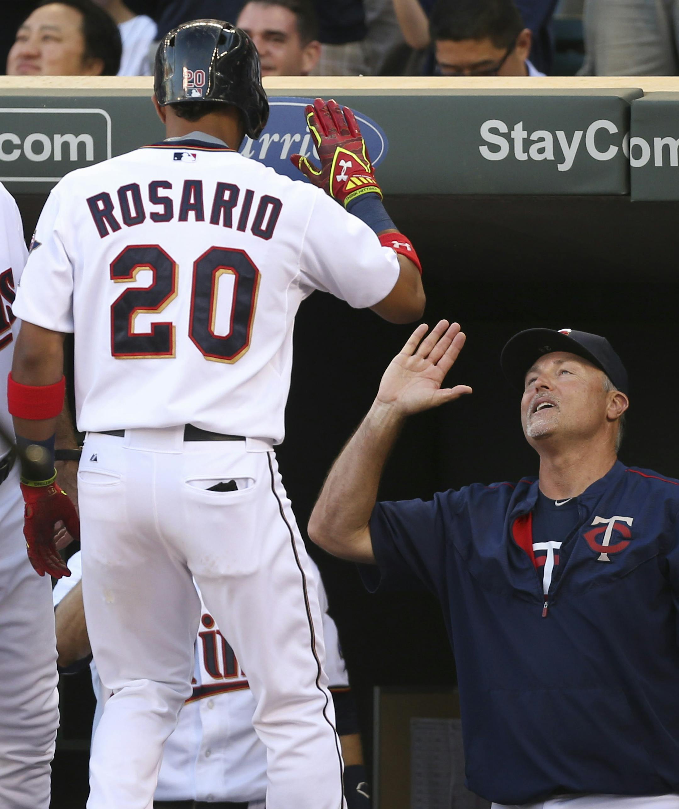 Minnesota Twins left fielder Eddie Rosario (20) was congratulated after he first inning three run home run by hitting coach Tom Brunansky Thursday evening. ] JEFF WHEELER ï jeff.wheeler@startribune.com The Minnesota Twins began a series with the Seattle Mariners Thursday night, July 30, 2015 at Target Field in Minneapolis.