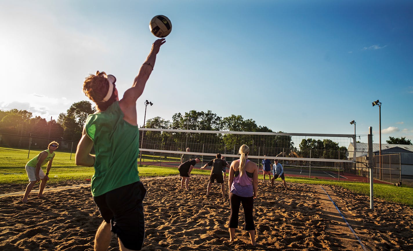 Volleyball players enjoy a game in the downtown park in Lake Elmo.