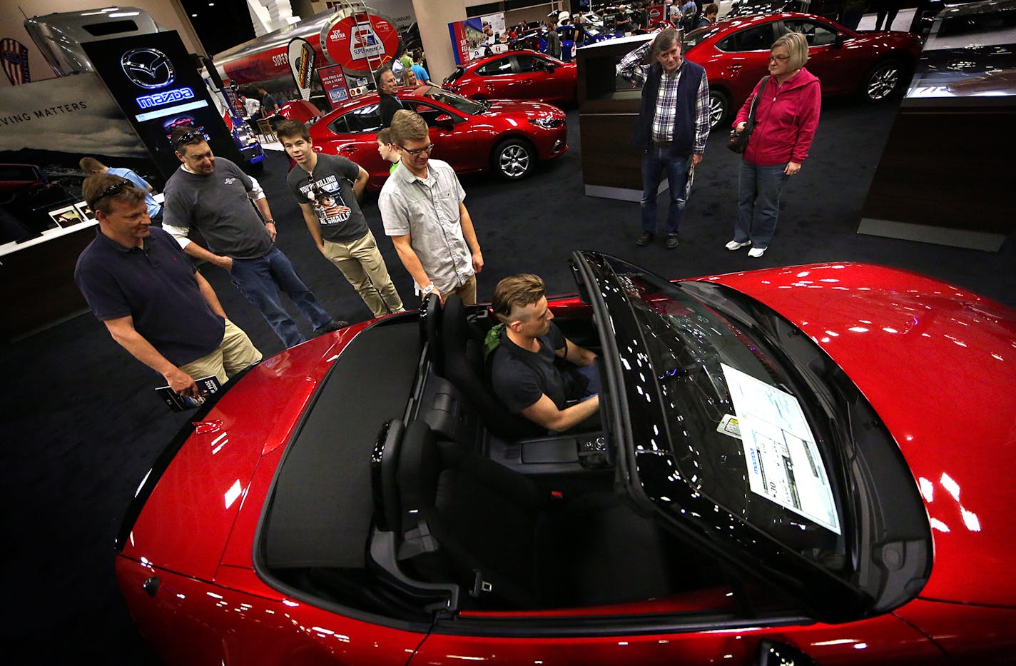 Automobile enthusiasts explored the features on a sporty, 2016 Mazda MX-5 Miata, with an MSRP of $33,135. ] JIM GEHRZ &#xef; james.gehrz@startribune.com /Minneapolis, MN / March 12, 2016 /10:00 AM - BACKGROUND INFORMATION: Please attend the media preview of the Twin Cities Auto Show for a story focusing on new tech features in cars. Preview is 10a-12p Saturday March 12. Reporter Katy Read is there. http://twincitiesautoshow.com/show-info/schedule