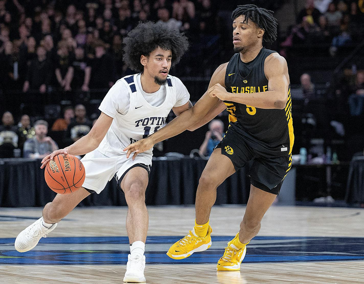 Totino-Grace's Taison Chatman draws a foul from DeLaSalle's PJ Pounds II, during the second half of their game in the Class 3A basketball state tournament at Target Center in Minneapolis, Minn., on Saturday, March 25, 2023. ] Elizabeth Flores • liz.flores@startribune.com