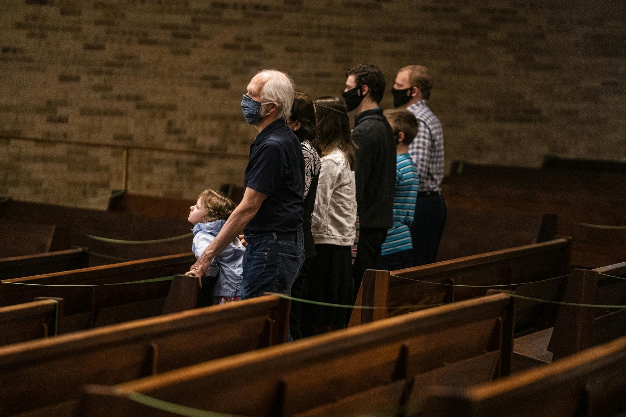 Parishioners including Ron Warner and his granddaughter Philomena Smith(5) were able to attend a service presided by Father John Paul Erickson as pews were closed off to allow social distancing and a maximum capacity of 250 or less than 25%. "I really enjoyed being back with them," said Warner who attended with his extended family.
