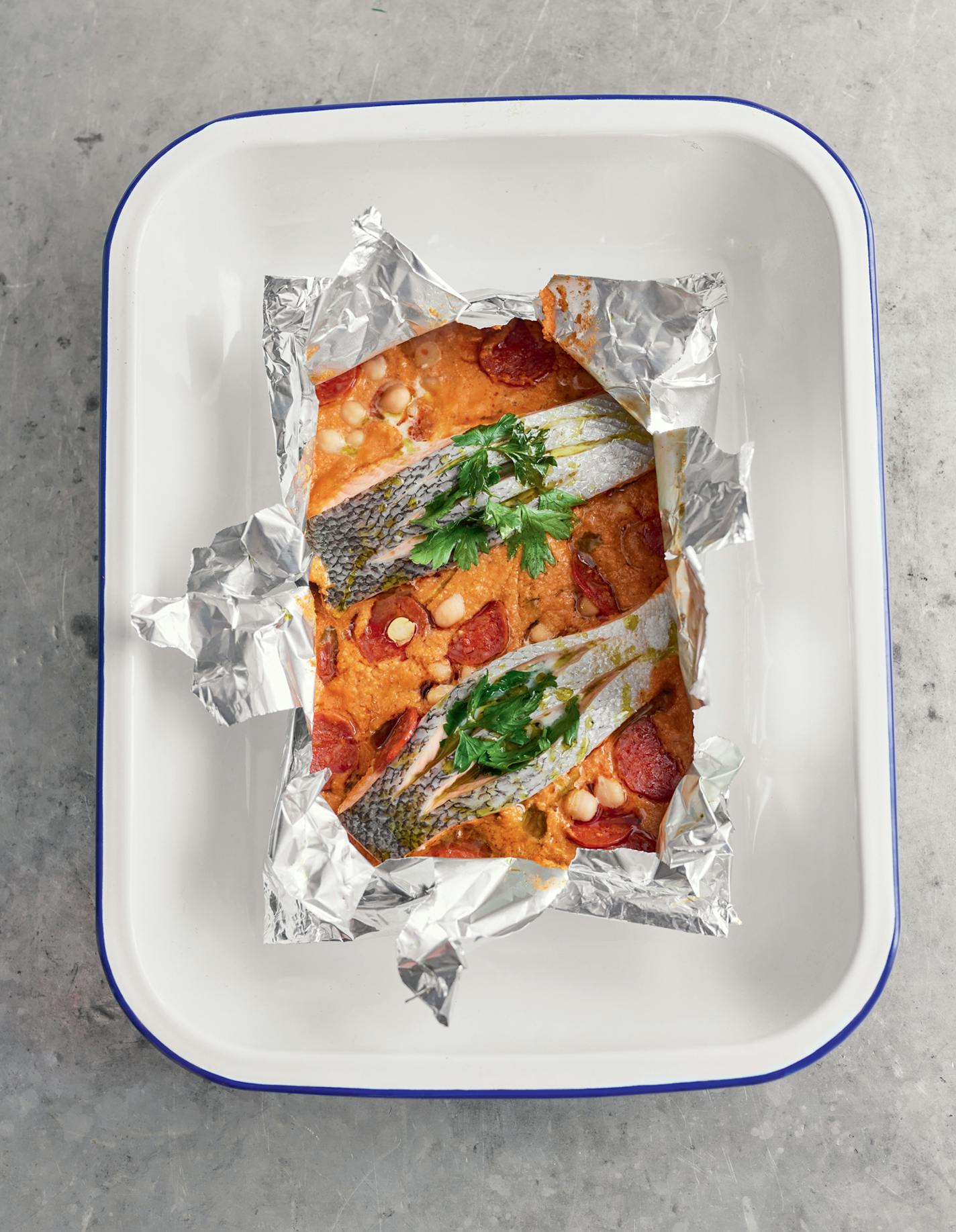 Salmon Pouches with Salmon and Chickpeas from "One: Simple One-Pan Wonders" by Jamie Oliver (Flatiron, 2023). Credit: DAVIS LOFTUS AND RICHARD CLATWORTHY