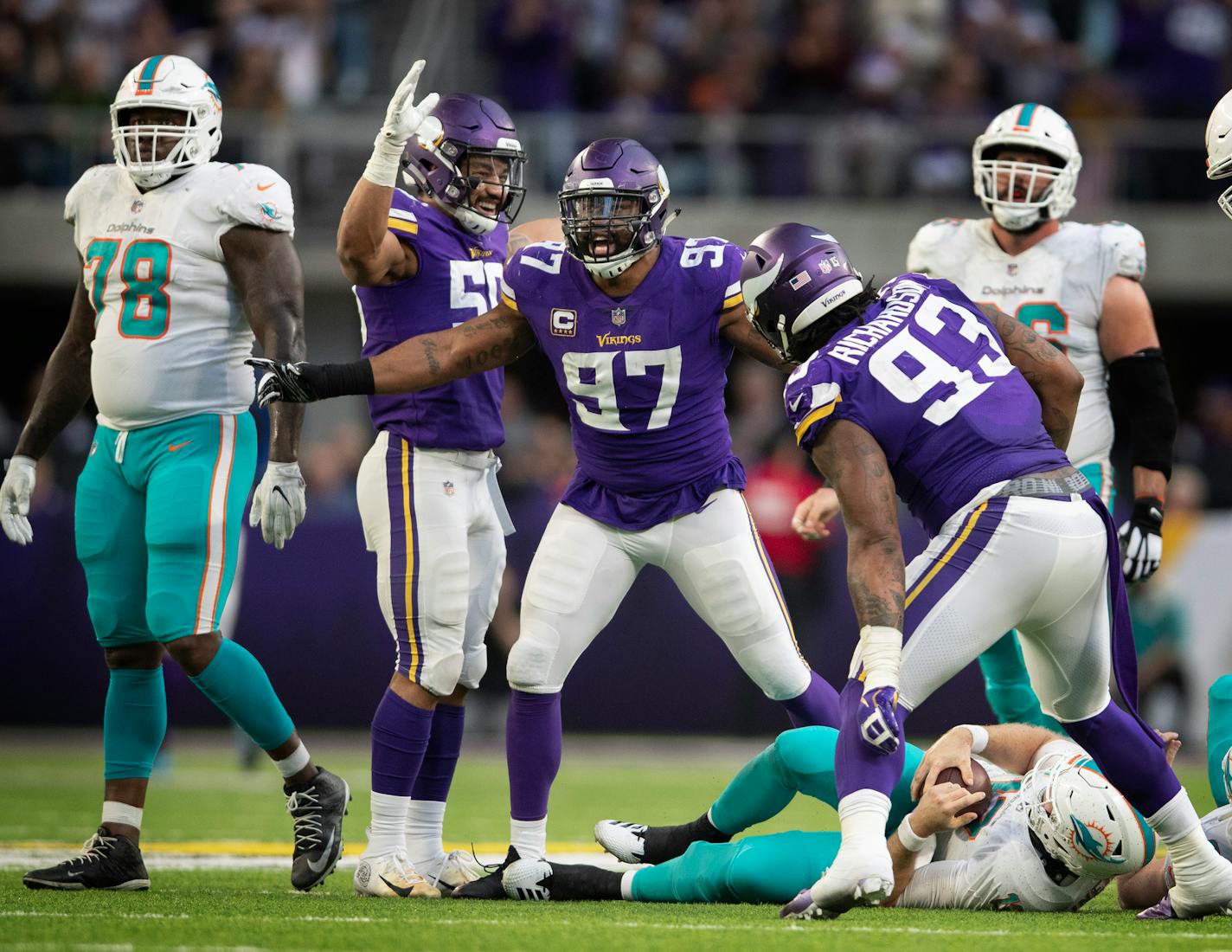 Vikings defensive end Everson Griffen celebrated his late fourth quarter sack of Dolphins quarterback Ryan Tannehill on Sunday, one of nine in the game for the Vikings.