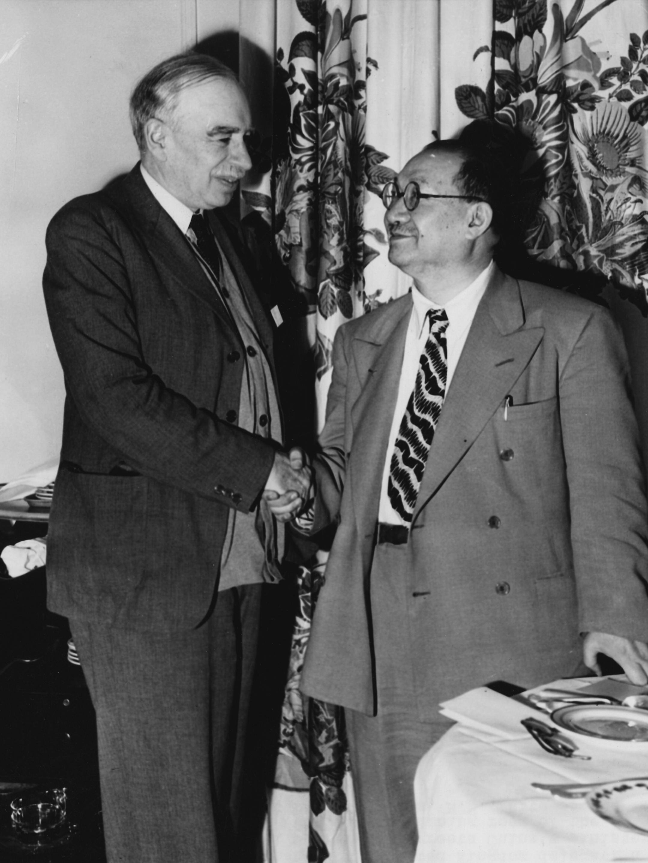 Lord John Maynard Keynes, left, chairman of the United Kingdom's delegation shakes hands with China's minister of finance, Dr. Hsiang-Hsi Kung, in the dining room of the Mount Washington Hotel, Bretton Woods, New Hampshire, USA, during the opening of the United Nations Monetary and Financial Conference July 1, 1944. (AP Photo) ORG XMIT: aphsf