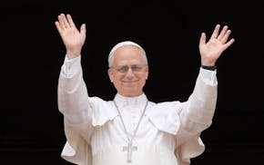 Pope Leo XIV appears at the central balcony of St. Peter's Basilica for his first Sunday blessing after his election, in St. Peter's Square at the Vat