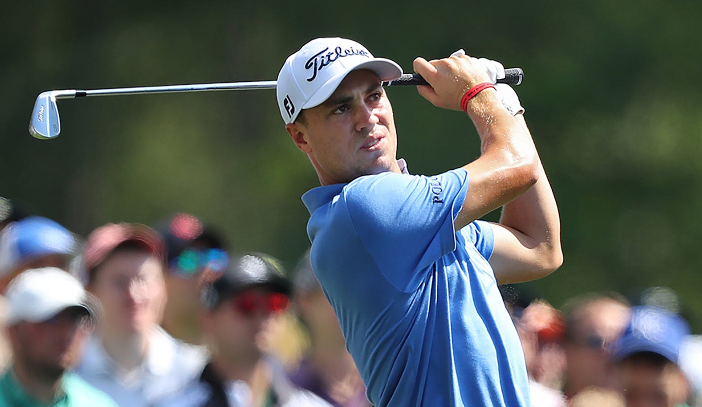 The gallery looks on while Justin Thomas tees off on the 12th hole at Amen Corner during his practice round for the Masters at Augusta National Golf Club on Tuesday, April 3, 2018, in Augusta, Ga. (Curtis Compton/Atlanta Journal-Constitution/TNS) ORG XMIT: 1227618