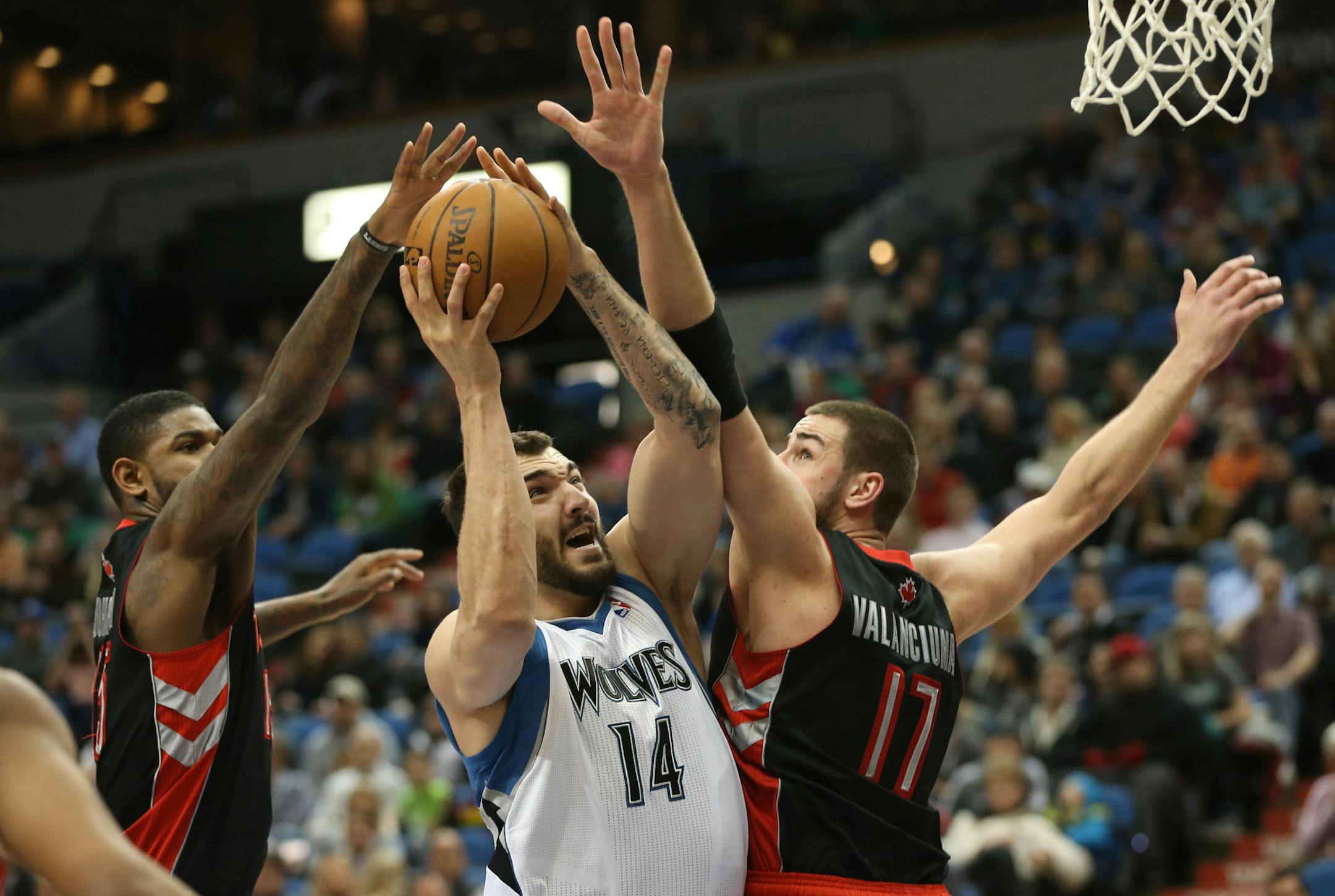 Minnesota Timberwolves vs. Toronto Raptors, 4/5/13. (center) Wolves Nikola Pekovic split the Raptor defense and drove to the basket.] Bruce Bisping/Star Tribune bbisping@startribune.com Nikola Pekovic/roster.