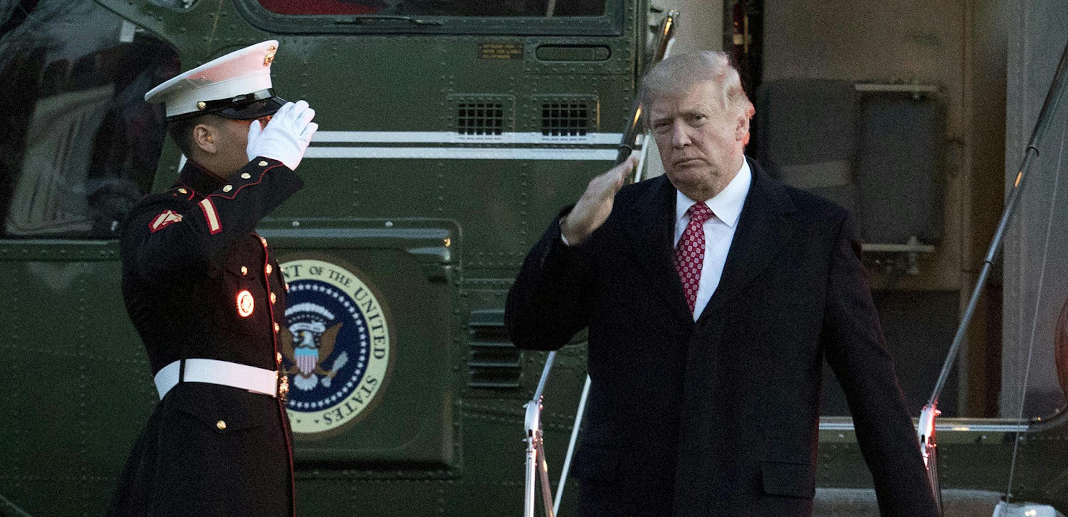 President Donald Trump salutes as he disembarks Marine One upon arrival at the White House in Washington, Sunday, March 5, 2017. (AP Photo/Manuel Balce Ceneta) ORG XMIT: MIN2017030614261622