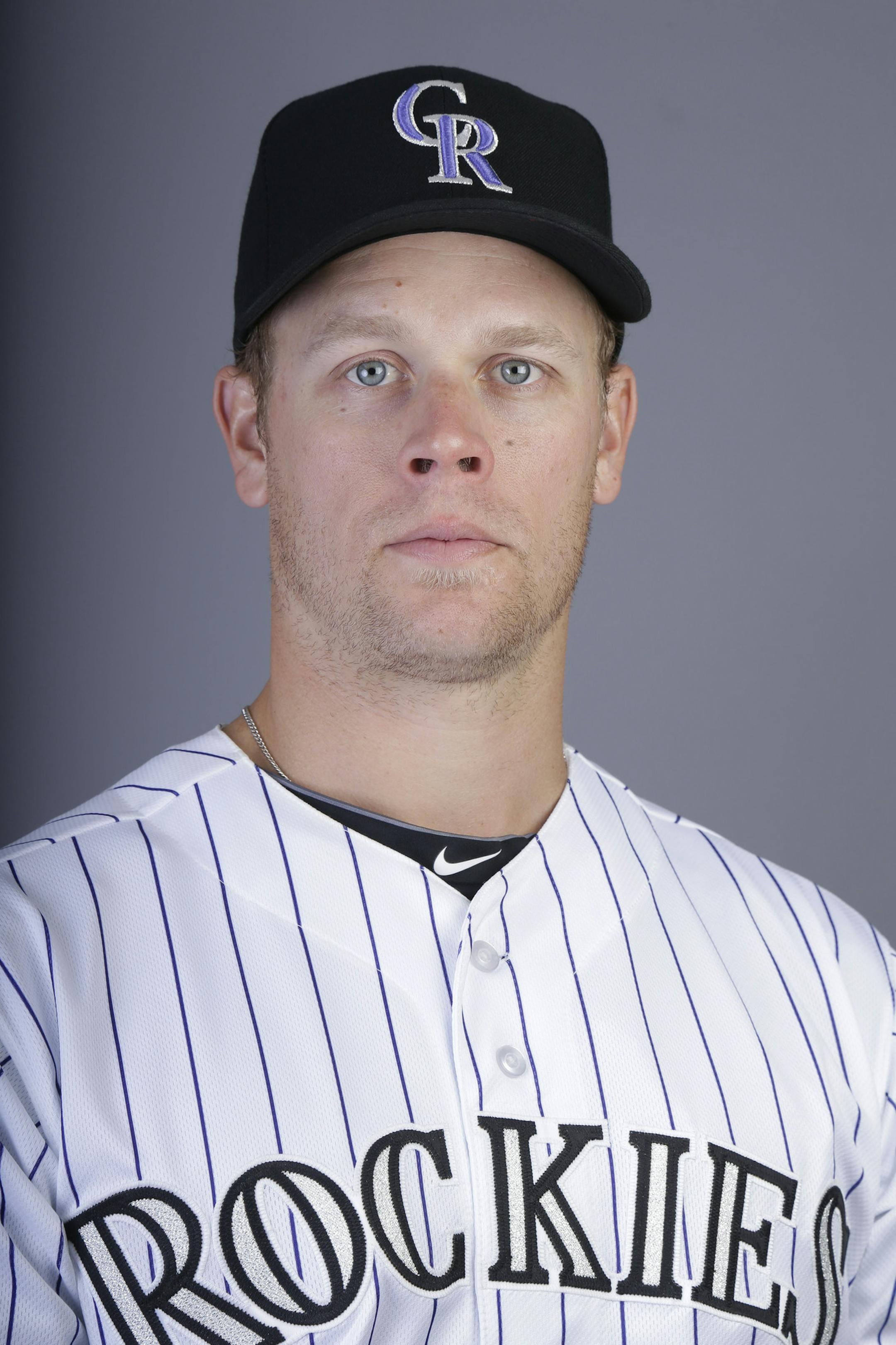 This is a 2014 photo of Justin Morneau of the Colorado Rockies baseball team. This image reflects the Rockies active roster as of Wednesday, Feb. 26, 2014, when this image was taken. (AP Photo/ Gregory Bull) ORG XMIT: AZGB10
