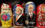 In this Monday, Feb. 20, 2017 traditional Russian wooden dolls called Matryoshka depicting US President Donald Trump, centre left and Russian Presiden