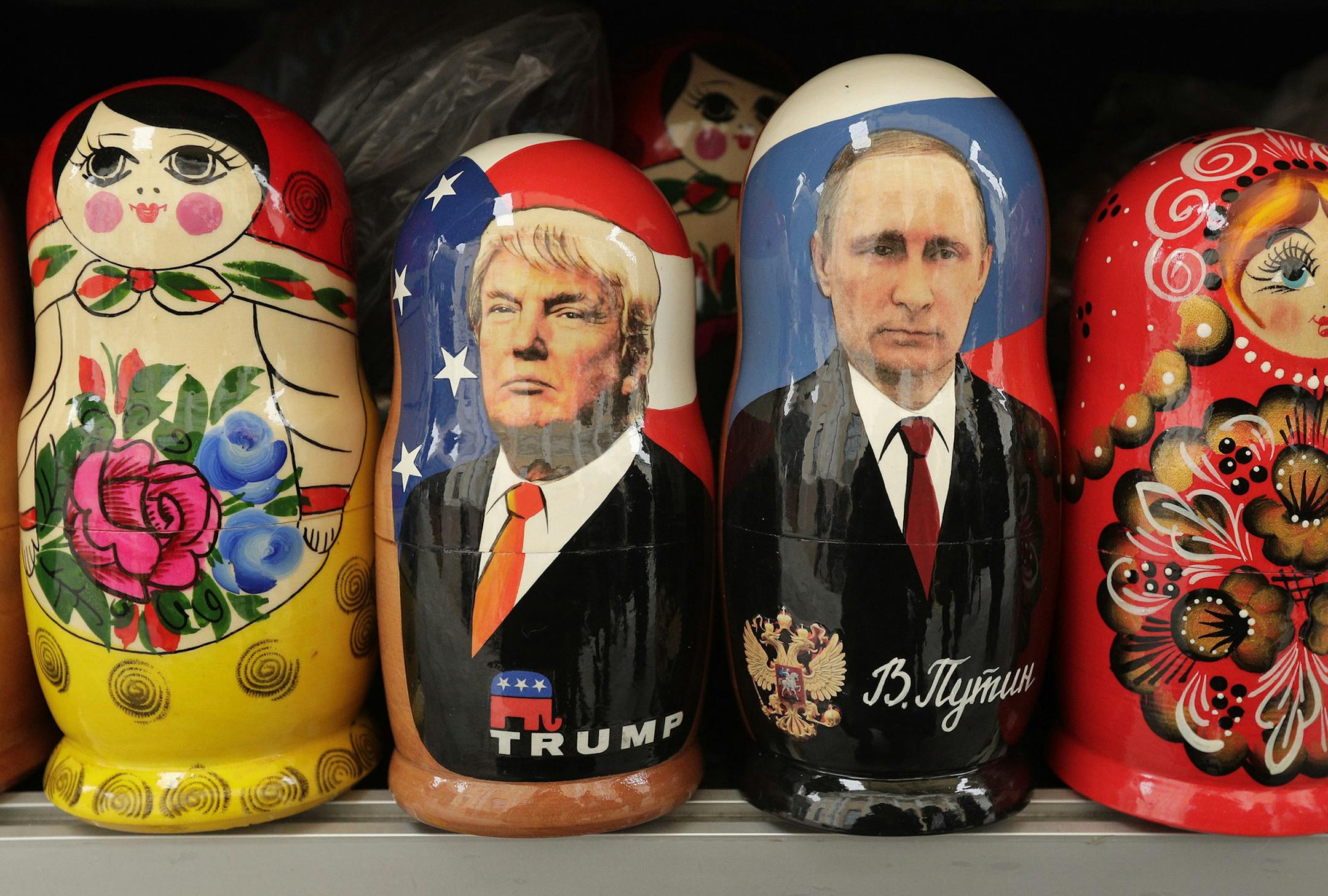 In this Monday, Feb. 20, 2017 traditional Russian wooden dolls called Matryoshka depicting US President Donald Trump, centre left and Russian President Vladimir Putin are displayed for sale at a souvenir street shop in St.Petersburg, Russia.?The Kremlin refrained from comment Tuesday, Feb. 21, 2017 on the appointment of the new U.S. national security adviser Army Lt. Gen. H.R. McMaster, but one lawmaker said he was likely to take a hawkish stance toward Russia. (AP Photo/Dmitri Lovetsky) ORG XMI