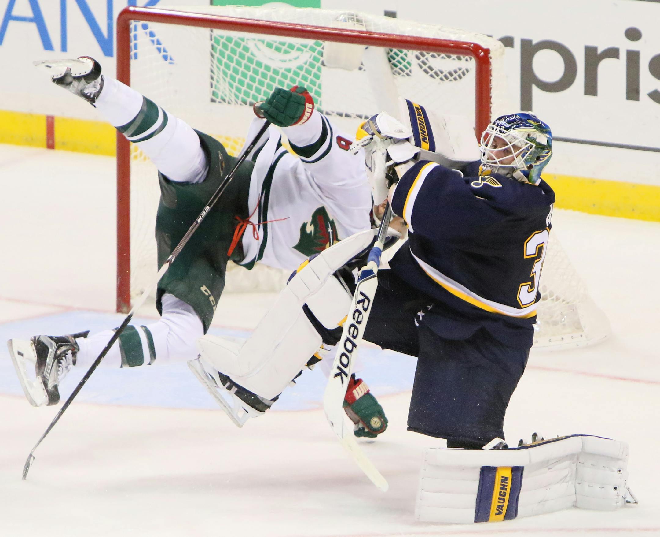 The Minnesota Wild's Marco Scandella collides with St. Louis Blues goaltender Jake Allen, right, in overtime on Saturday, Oct. 31, 2015, at the Scottrade Center in St. Louis. The Blues won, 3-2, in OT.