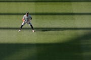 Twins left fielder Willi Castro waits in the outfield during the eighth inning of Thursday's game at Kansas City. Castro started in left field and pla