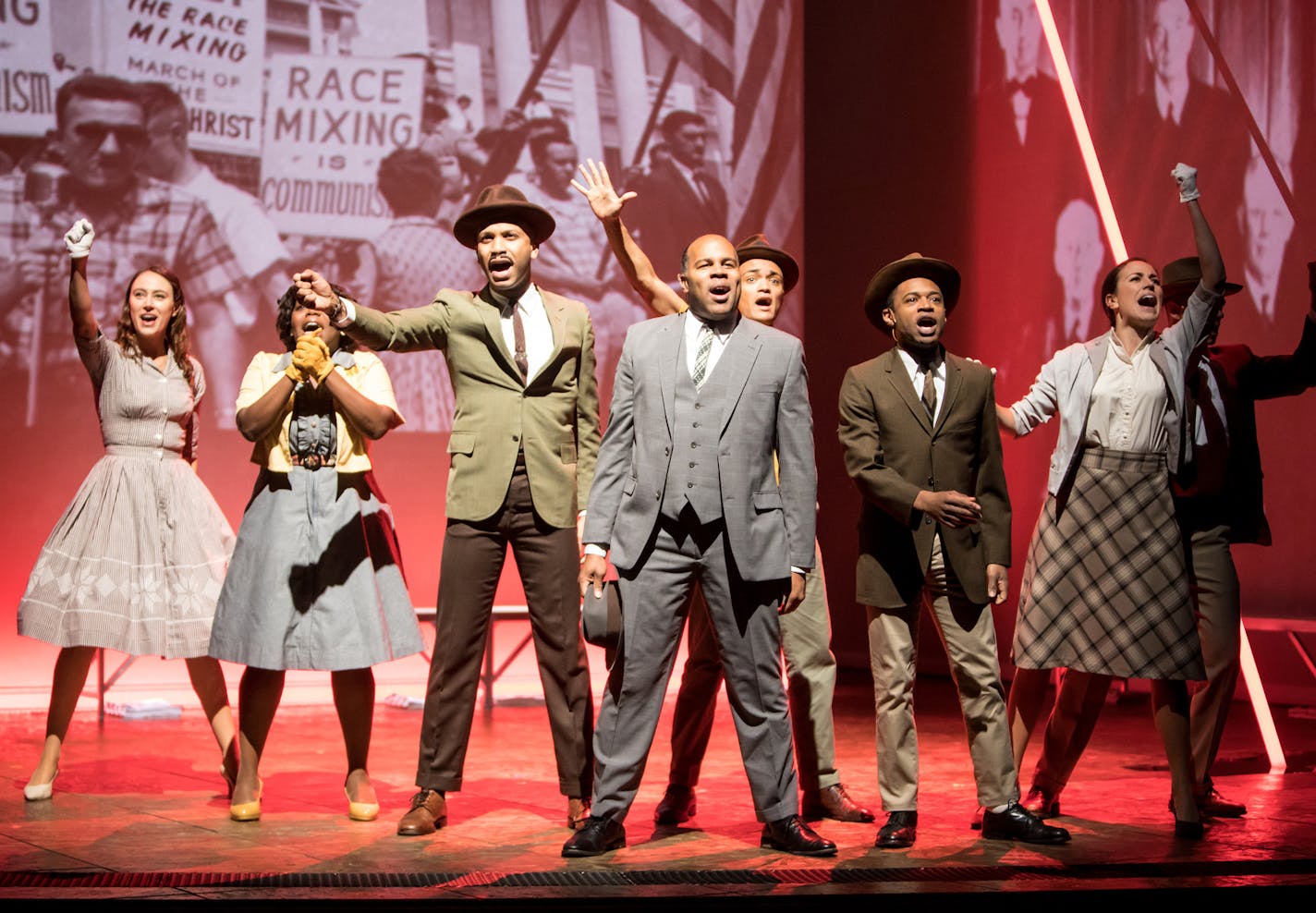 The cast of the Guthrie Theater's The Parchman Hour, written by Mike Wiley and directed by Patricia McGregor. Scenic design by Clint Ramos, costume design by Katherine O'Neill, lighting design by Jiyoun Chang and projection design by Tom Mays. October 1 - November 6, 2016 on the McGuire Proscenium Stage at the Guthrie Theater, Minneapolis. Photo by Dan Norman.