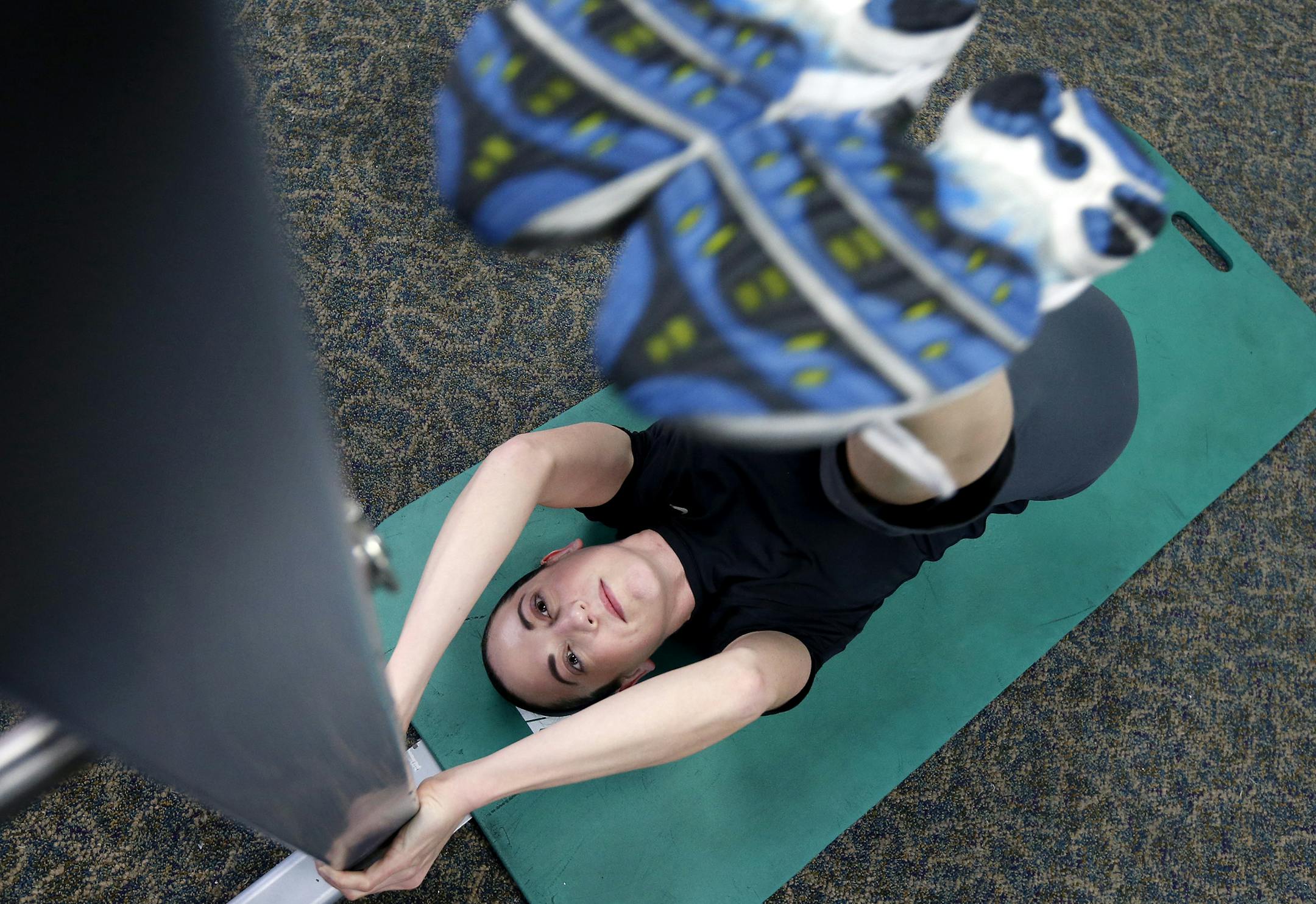 Maggie Tatton, 34, during a workout at Fitness Pros in Blaine. Tatton is training for her second triathlon. ] CARLOS GONZALEZ cgonzalez@startribune.com April 03, 2013, Blaine, Minn., Fitness Pros, Blaine will be holding its second annual triathlon; a look at several of the participants as they train for the May event.