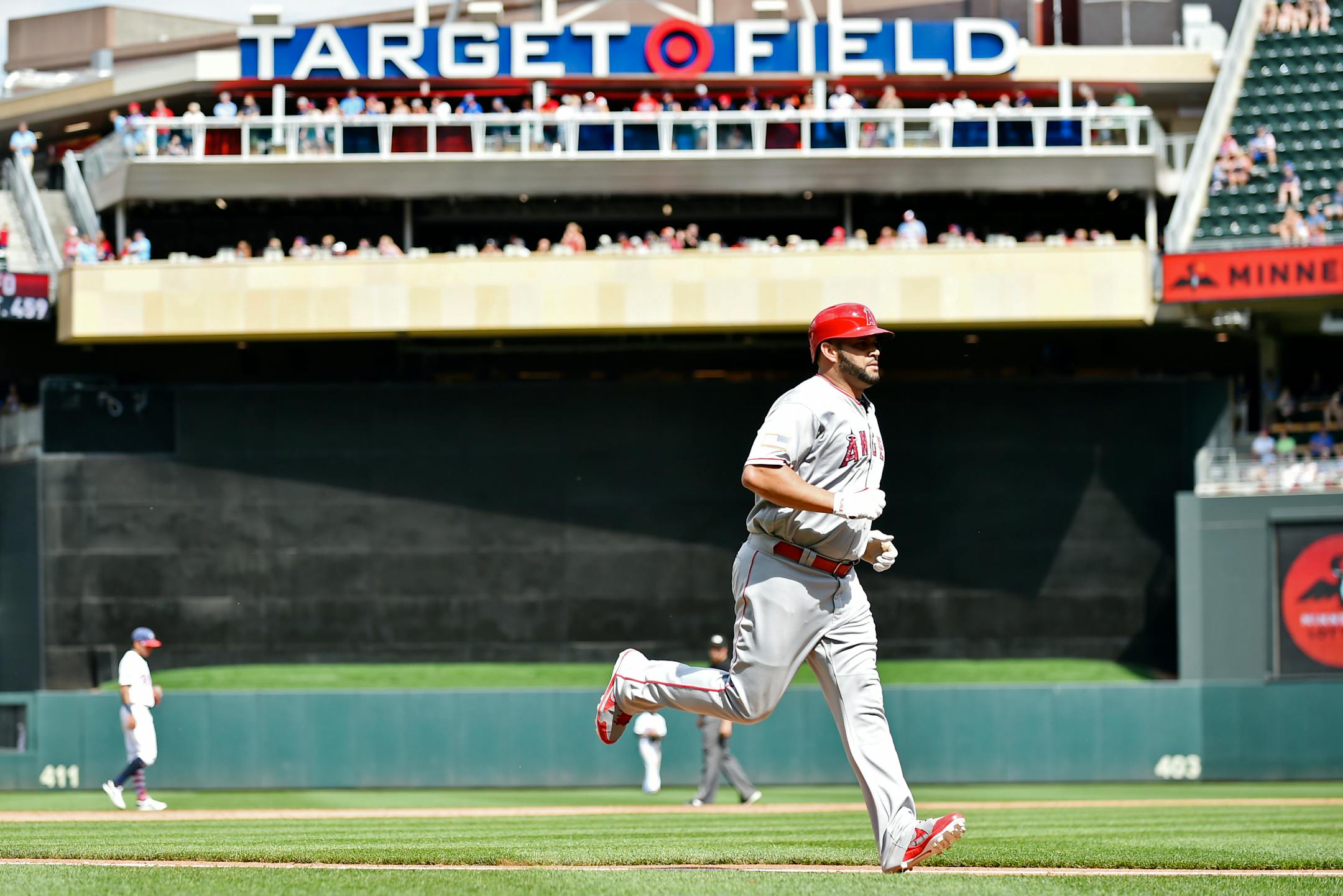 Los Angeles Angels' Albert Pujols rounds the bases after hitting a home run against the Minnesota Twins in the eighth inning of a baseball game, Tuesday July 4, 2017, in Minneapolis. The Twins won, 5-4. (AP Photo/John Autey)