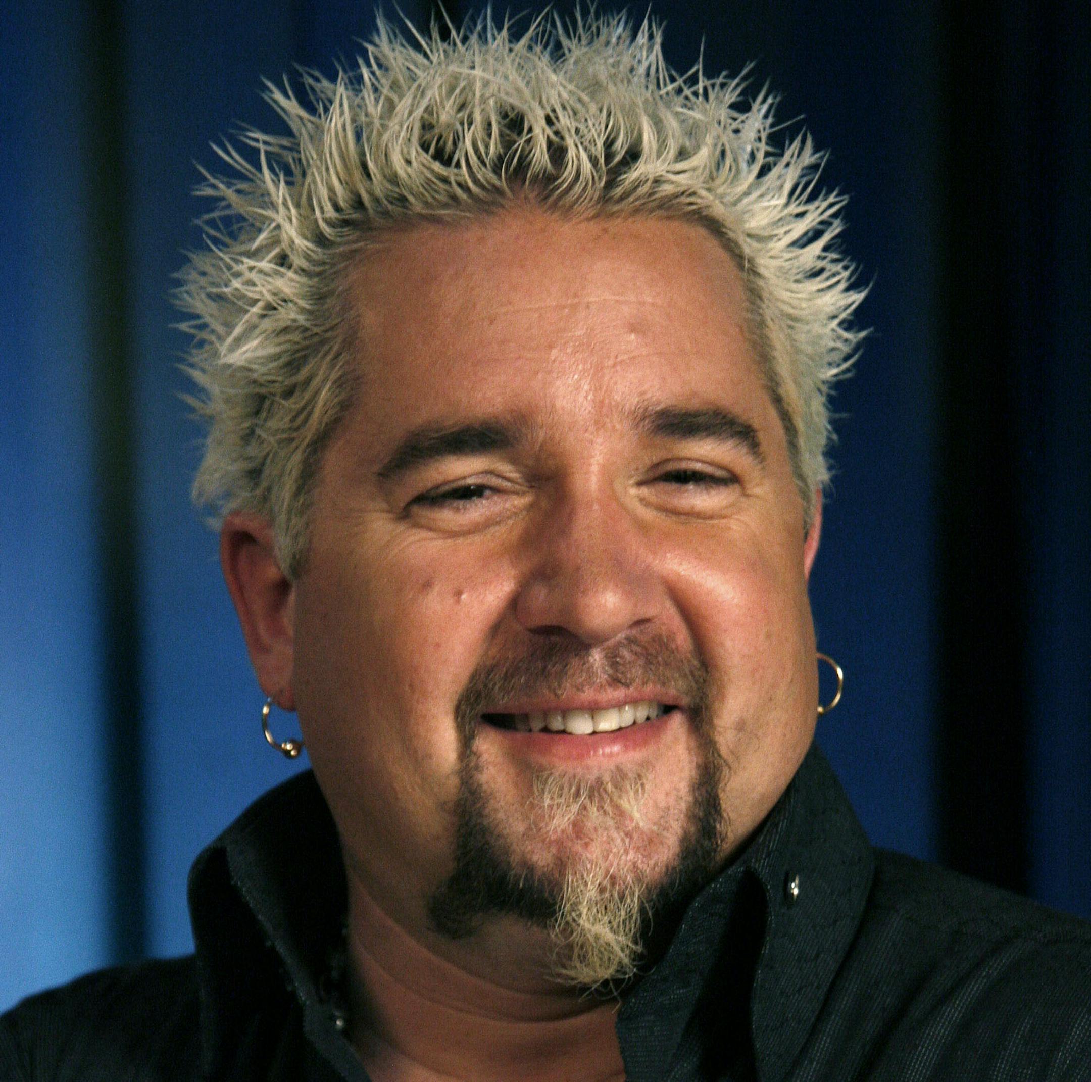 FILE- This Wednesday, May 4, 2011 file photo shows Guy Fieri as he poses for a portrait in New York. For the APís 20 Salads of Summer series, Fieri offered an intense salad of grilled romaine lettuce topped with bacon, onions, blue cheese and a tangy vinaigrette made with the bacon drippings. (AP Photo/Jeff Christensen, FILE)