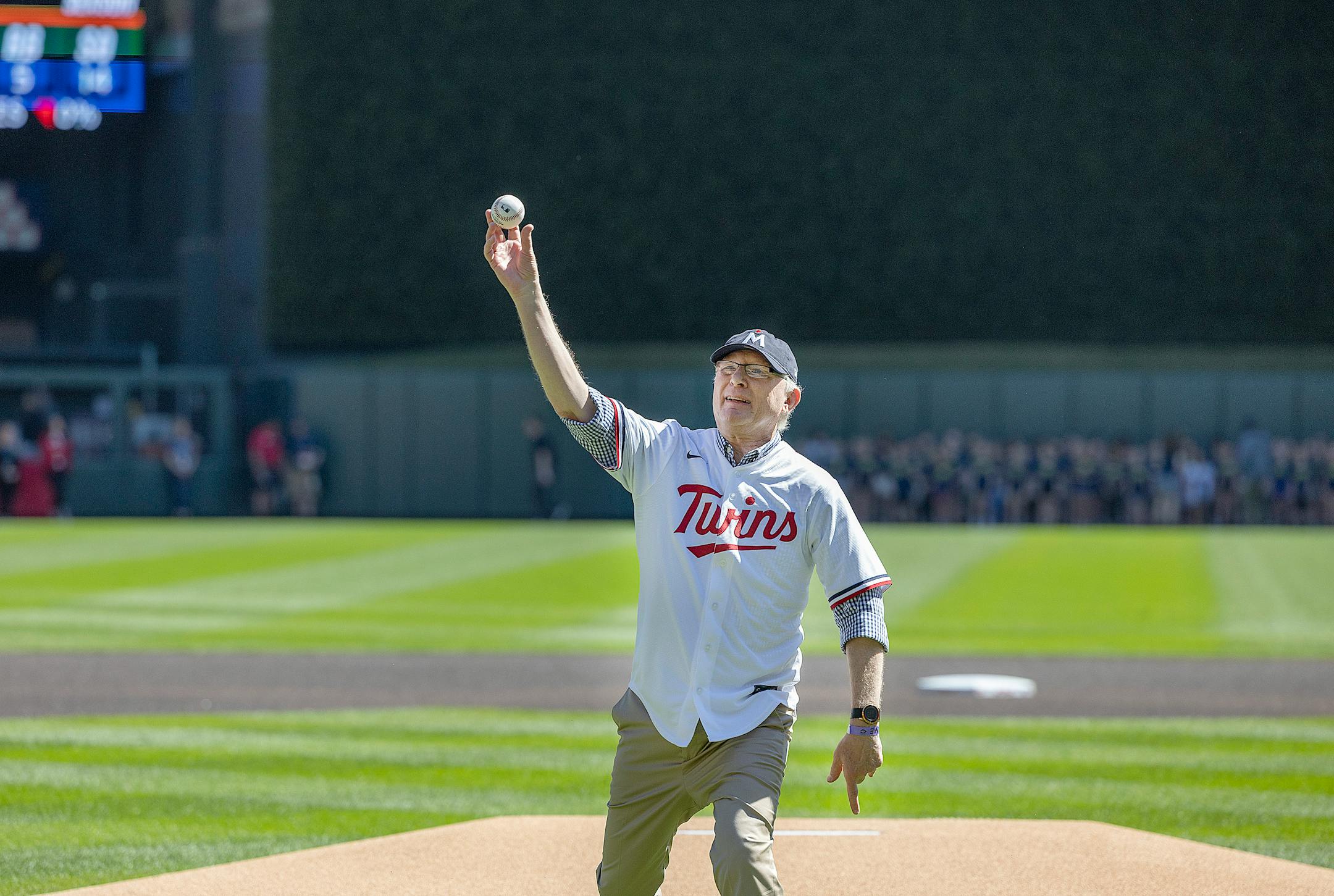 Retiring Star Tribune publisher Mike Klingensmith throws out the ceremonial first pitch before the Twins took on the Chicago White Sox at Target Field Wednesday.