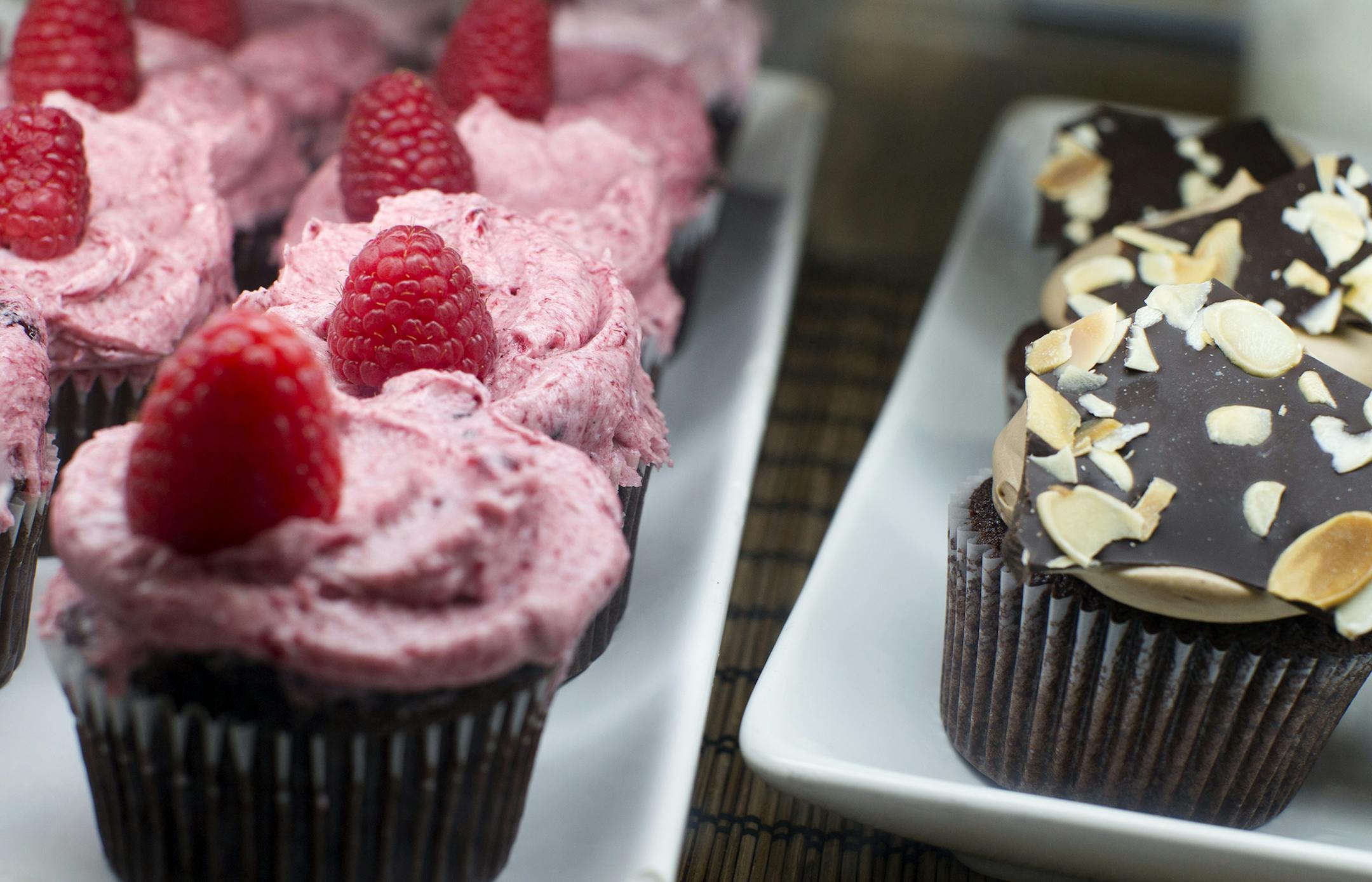 Raspberry and flourless chocolate cupcakes are two of the many fresh-baked items for sale at Salty Tart in Midtown Global Market in Minneapolis September 21, 2013. (Courtney Perry/Special to the Star Tribune)