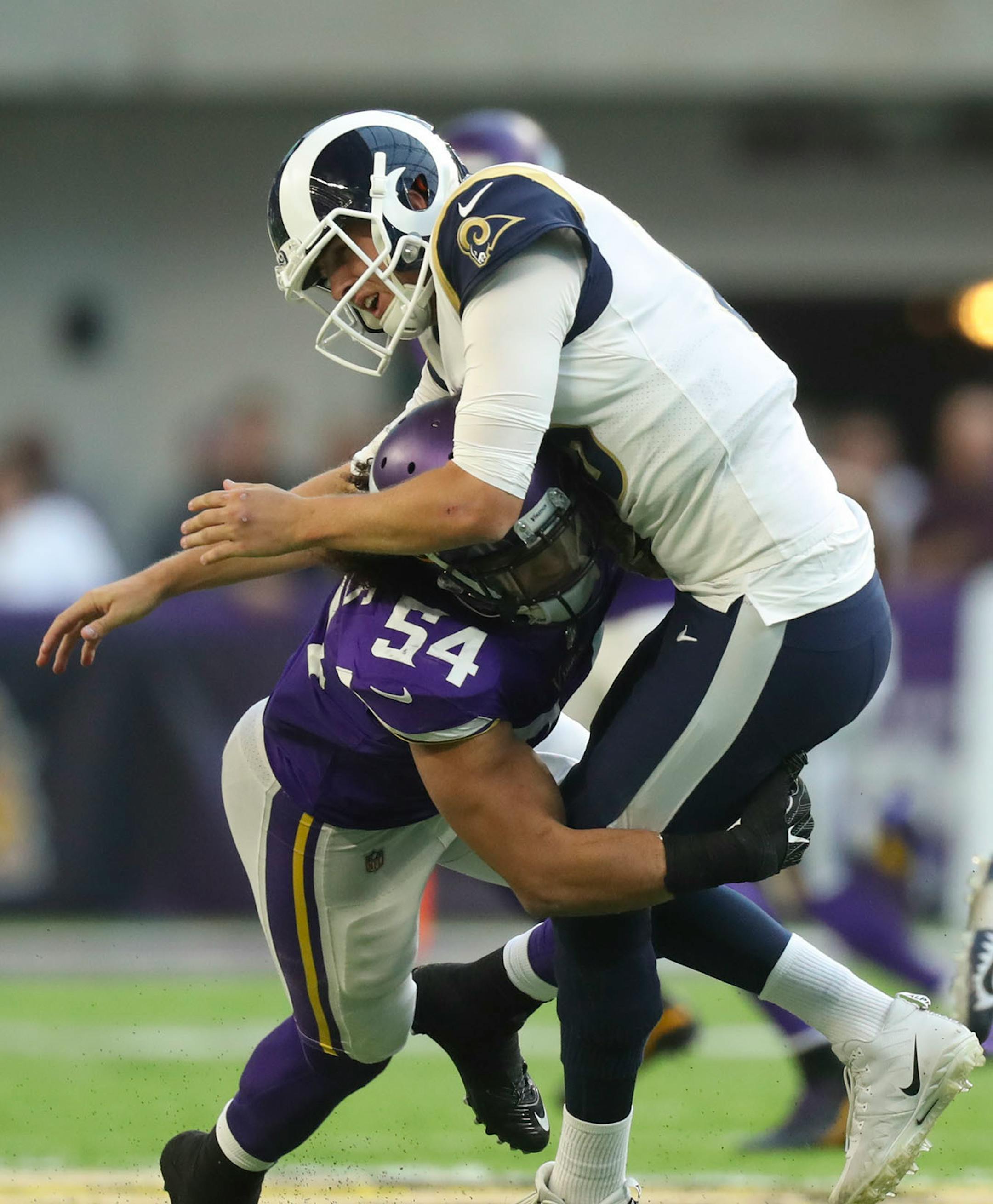 Minnesota Vikings middle linebacker Eric Kendricks (54) hit Los Angeles Rams quarterback Jared Goff (16) after he got a fourth quarter pass off.