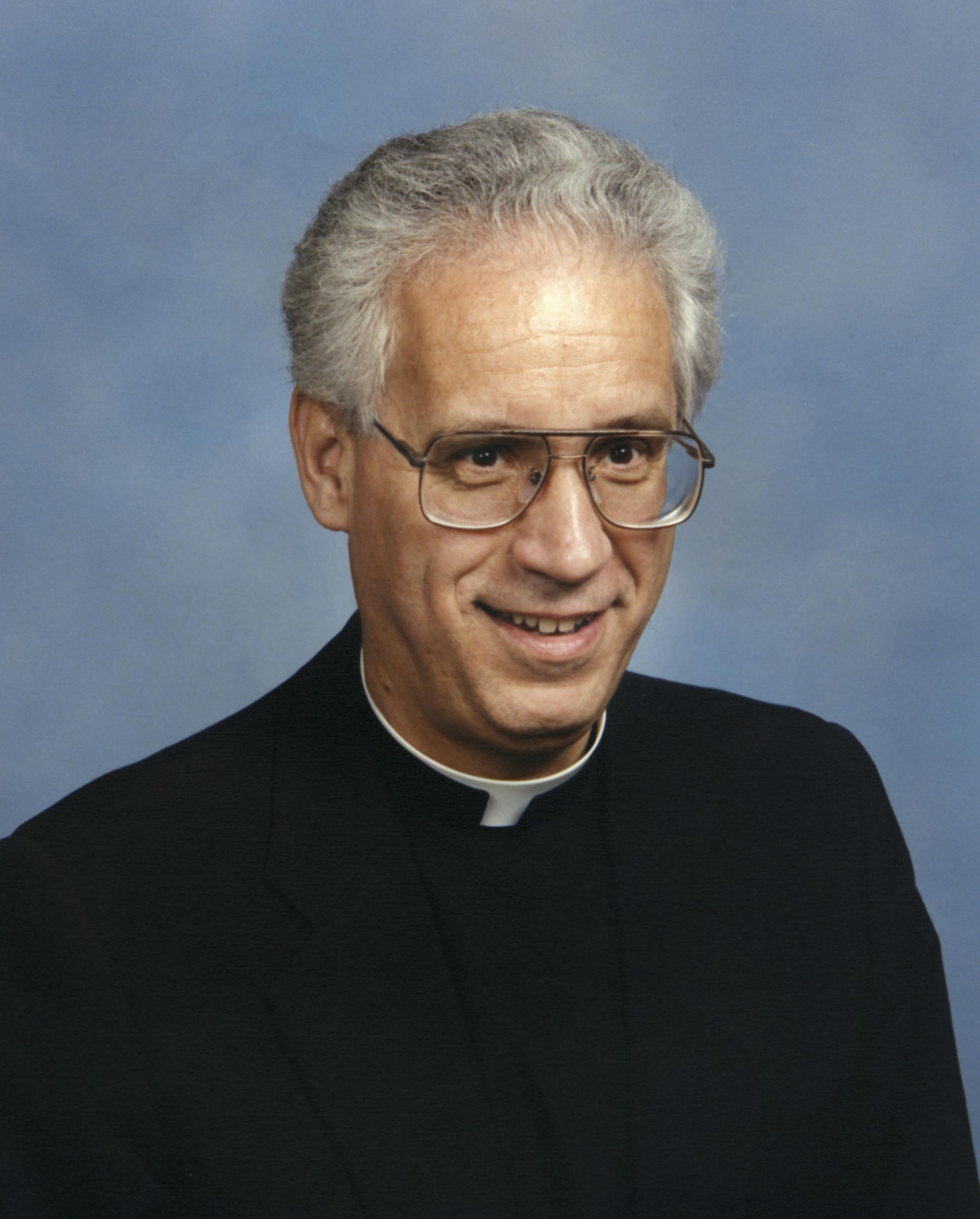 Father Charles Froehle who was a professor, dean and rector at the St. Paul Seminary School of Divinity. Scanned on January 13, 2015. Original print by Olan Mills Studio in 1989.