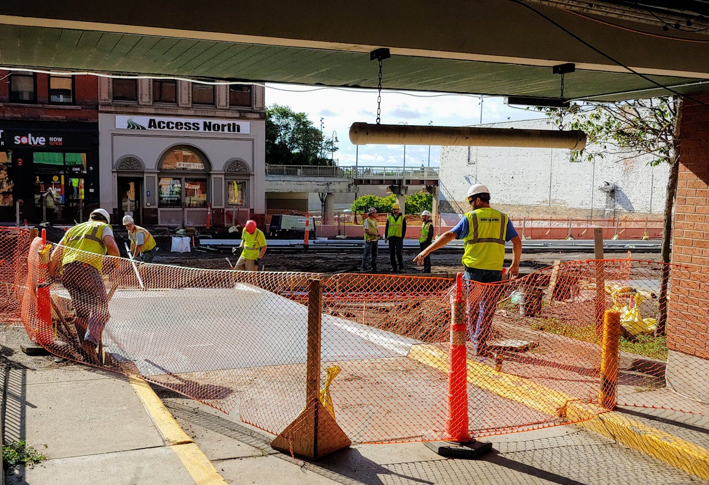 Work continues on East Superior Street in downtown Duluth Tuesday morning outside the HART District parking ramp.