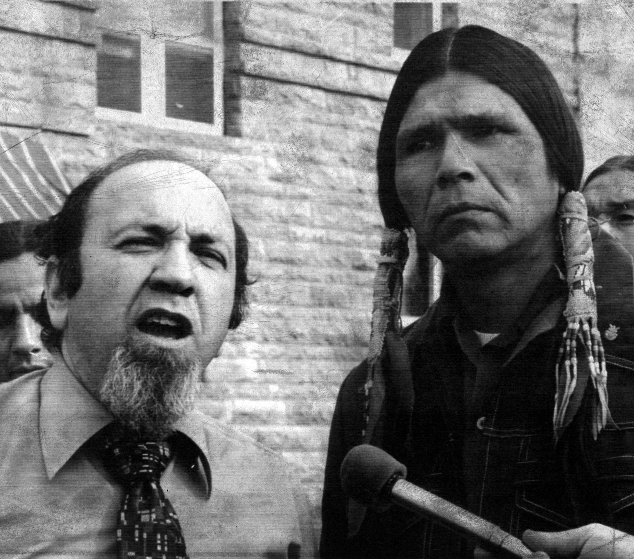 April 25, 1974: American Indian Movement leader Dennis Banks (right) and AIM attorney Kenneth Tilsen of St. Paul, Minn., flew to Sioux Falls, S.D., Thursday to show support for Ramon Roubideaux, an AIM lawyer who was sentenced to one day in jail for contempt of court.