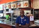 Abdirahman Kahin, owner of Afro Deli in the African Development Center near the west bank of the University of Minnesota, believes his popular busines
