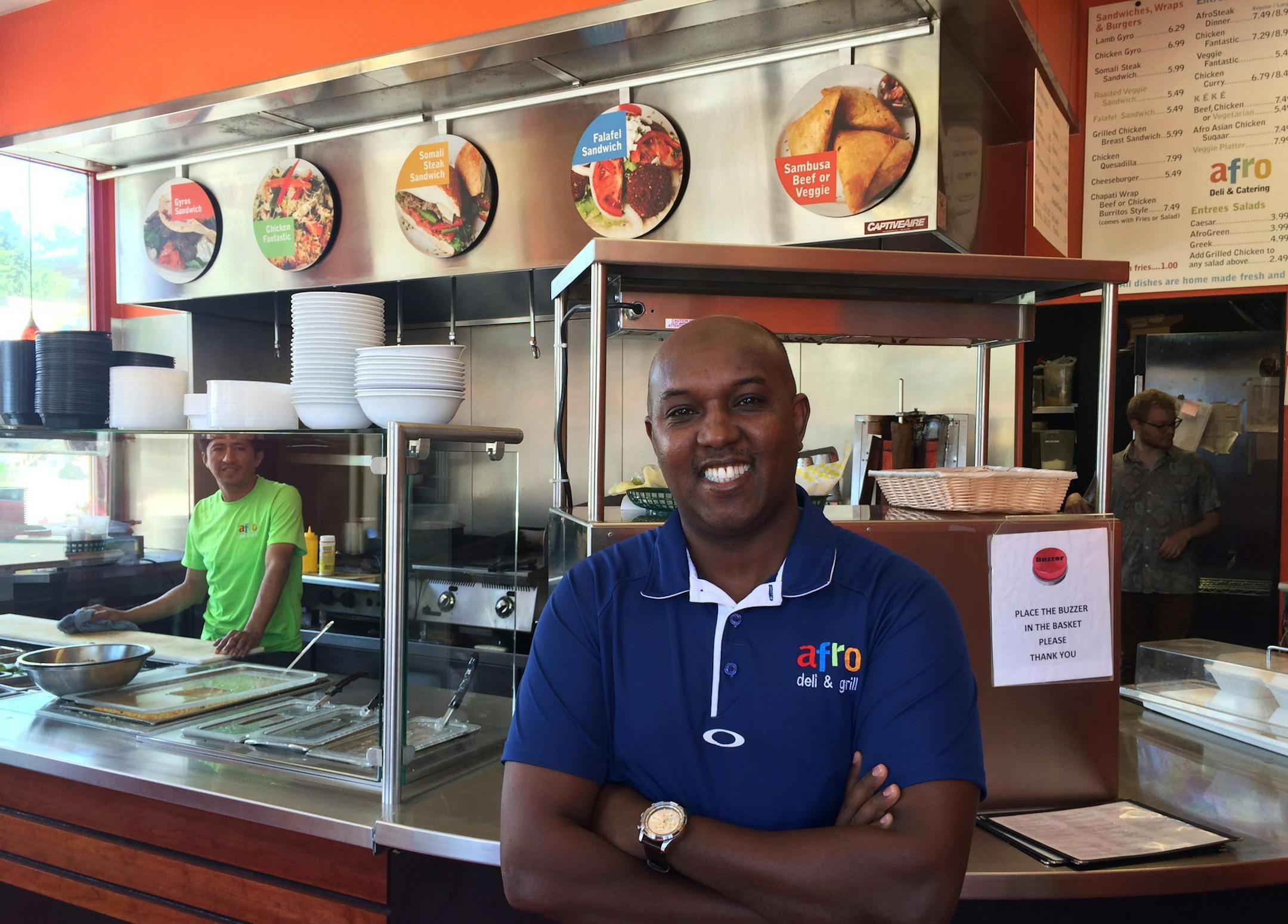 Abdirahman Kahin, owner of Afro Deli in the African Development Center near the west bank of the University of Minnesota, believes his popular business is being unfairly treated by the landlord. Photo: Neal.St.Anthony@startribune.com