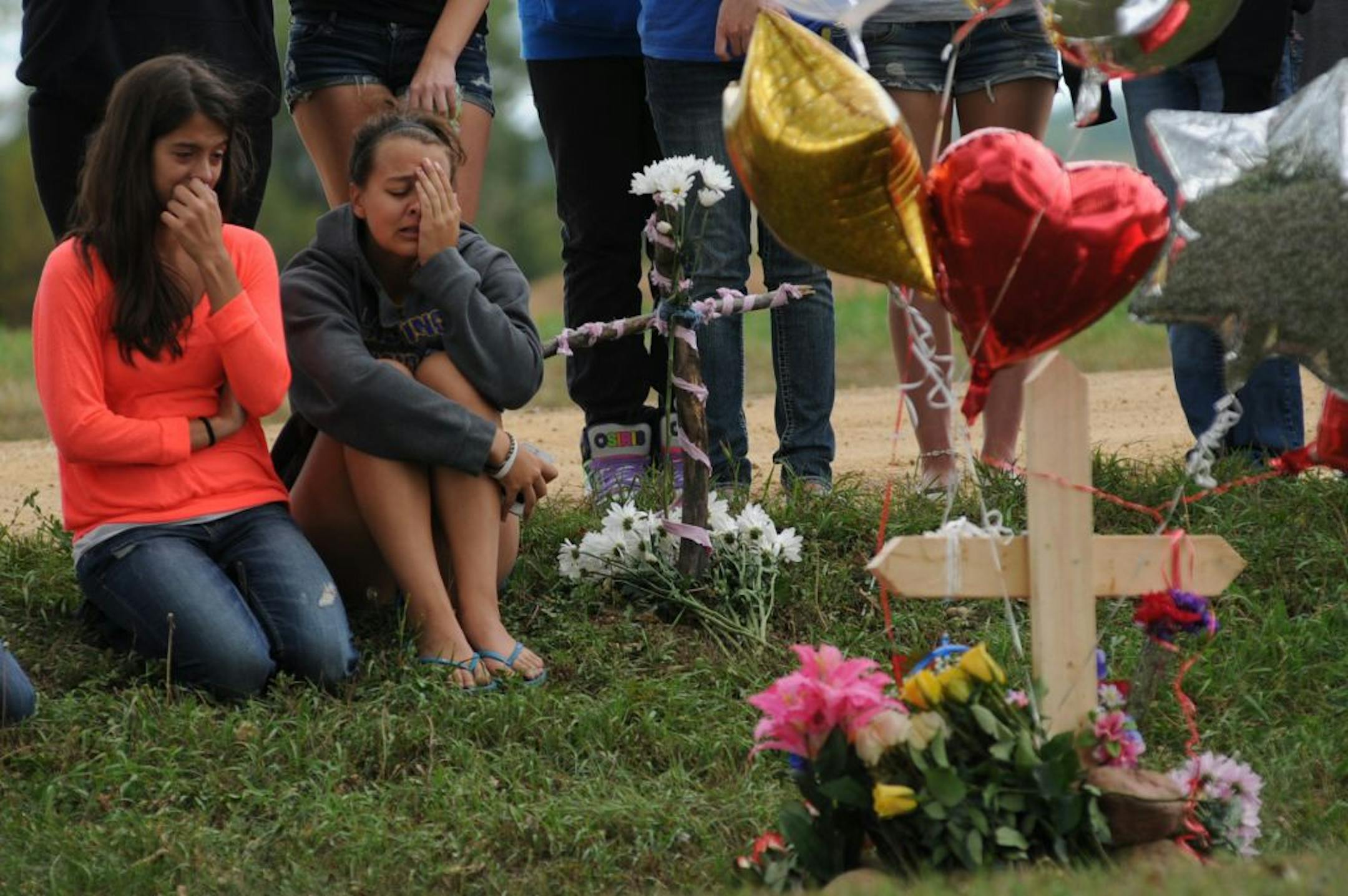 Friends and classmates gathered on Sept. 7 at the site where 16-year-old Maddy Sake was killed the day before when her car and a pickup collided near Hastings. A boy she had once dated hanged himself a month later; a second boy killed himself shortly after that.