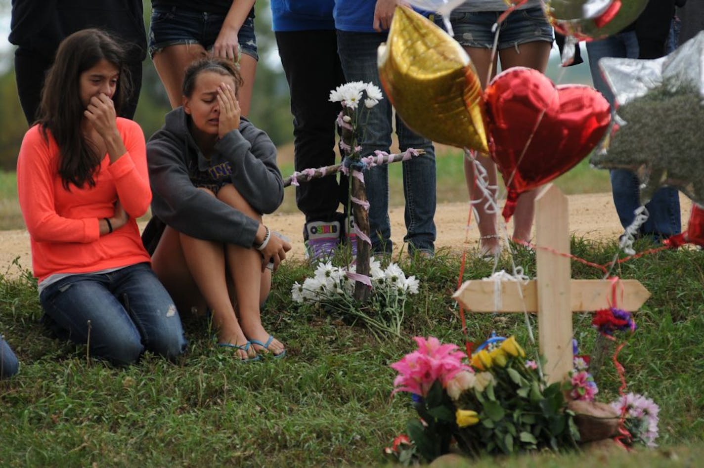 Friends and classmates gathered on Sept. 7 at the site where 16-year-old Maddy Sake was killed the day before when her car and a pickup collided near Hastings. A boy she had once dated hanged himself a month later; a second boy killed himself shortly after that.