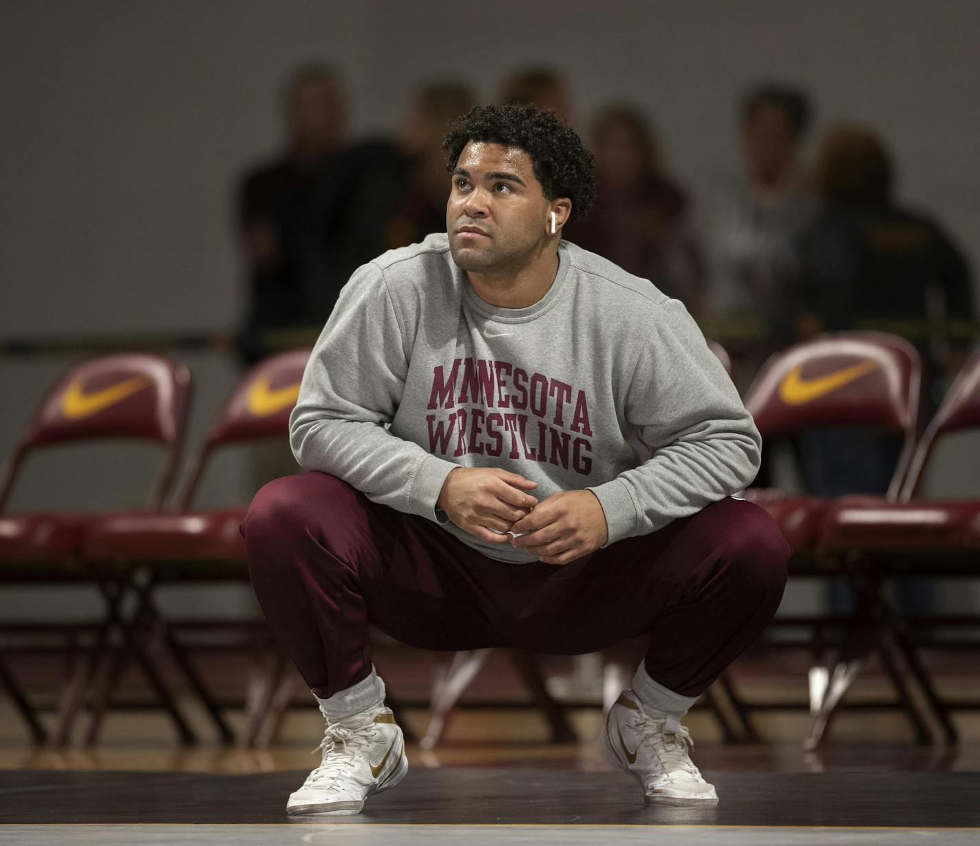 Gable Steveson warms up before wrestling in an NCAA Big Ten tournament in Minneapolis, Minn, Sunday, Jan. 6, 2019. Nationally-ranked University of Minnesota heavyweight wrestler Gable Steveson and a teammate have been arrested on suspicion of criminal sexual conduct. KSTP-TV reports that jail records show Steveson and Dylan Martinez were arrested Saturday night, June 15, 2019, at different times and places in Minneapolis. (Jerry Holt/Star Tribune via AP)