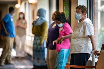 Nursing home workers waited to get tested for COVID-19 last August at Jones-Harrison Senior Living in Minneapolis.