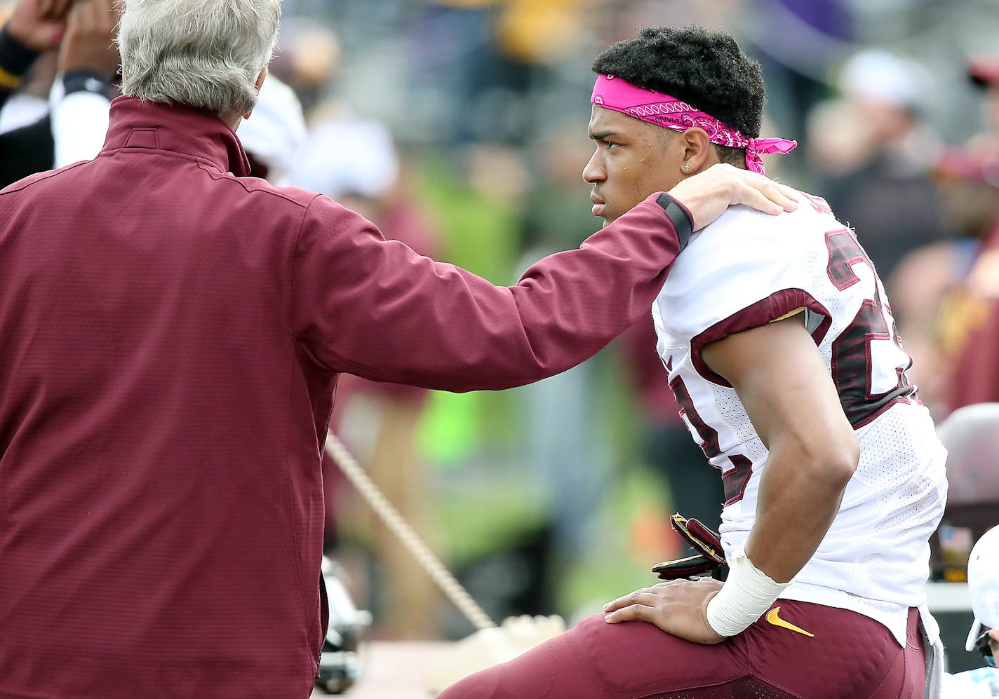 Minnesota's defensive back Craig James is comforted as he sat on the sideline with an injury during the last few minutes of the game as the Northwestern Wildcats defeated Minnesota 27-0 at Ryan Field, Saturday, October 3, 2015 in Evanston, IL. ] (ELIZABETH FLORES/STAR TRIBUNE) ELIZABETH FLORES &#x2022; eflores@startribune.com