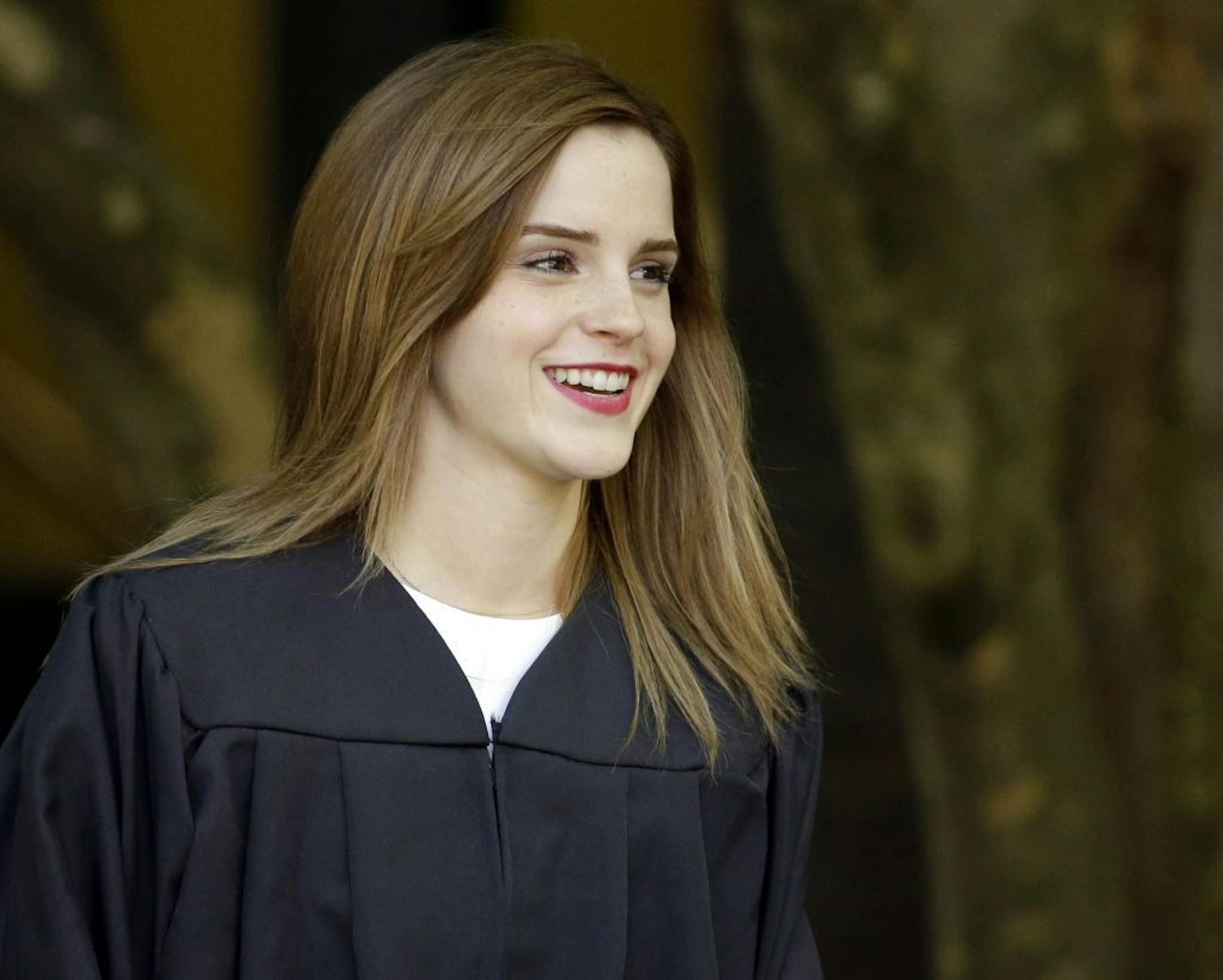 Actress Emma Watson walks between buildings following commencement services on the campus of Brown University, Sunday, May 25, 2014, in Providence, R.I.