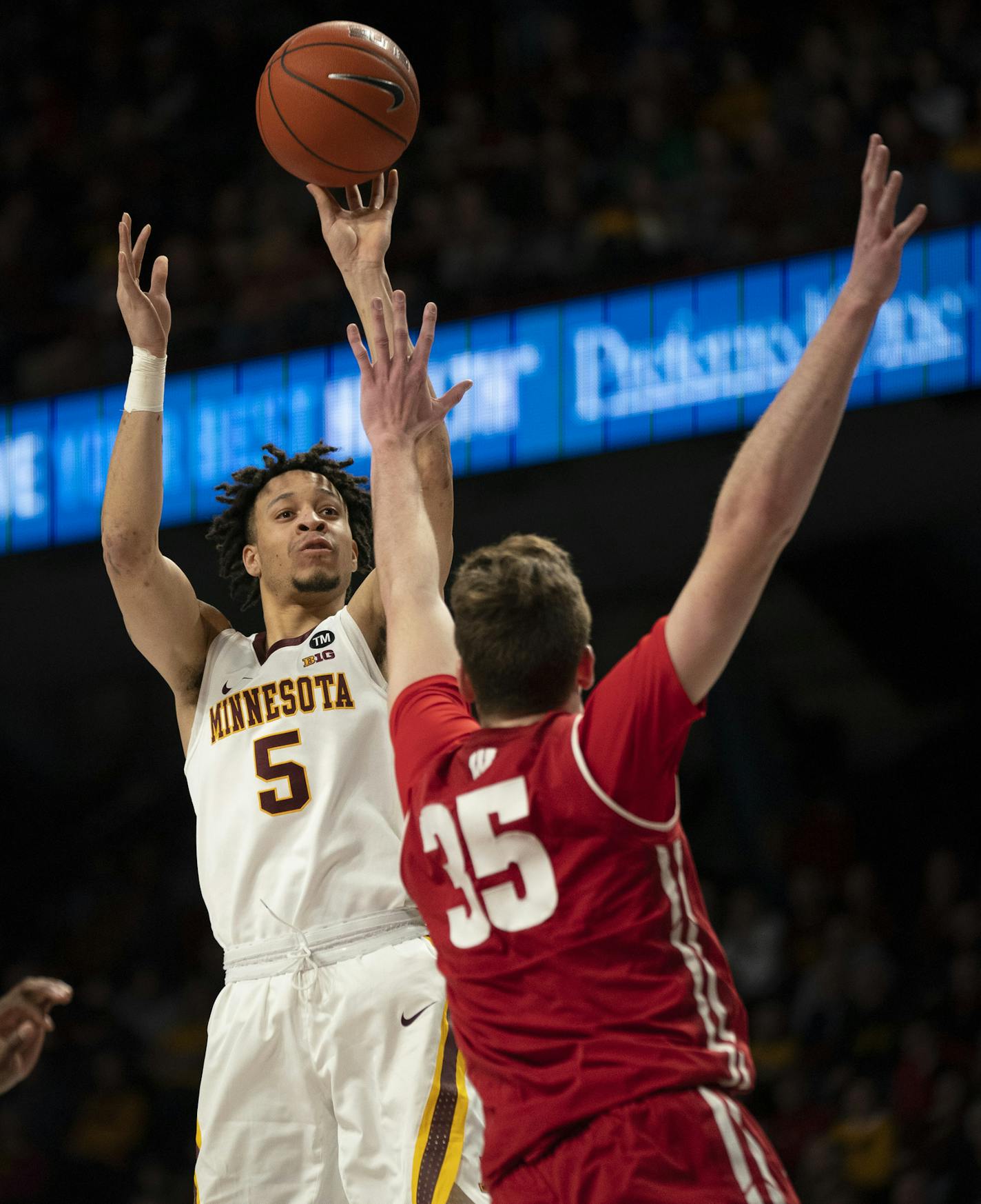 Gophers guard Amir Coffey (5) shot over Badgers forward Nate Reuvers (35) in the first half. ] JEFF WHEELER &#x2022; jeff.wheeler@startribune.com The University of Minnesota men's basketball team faced the University of Wisconsin Badgers in an NCAA game Wednesday night, February 6, 2019 at Williams Arena in Minneapolis.