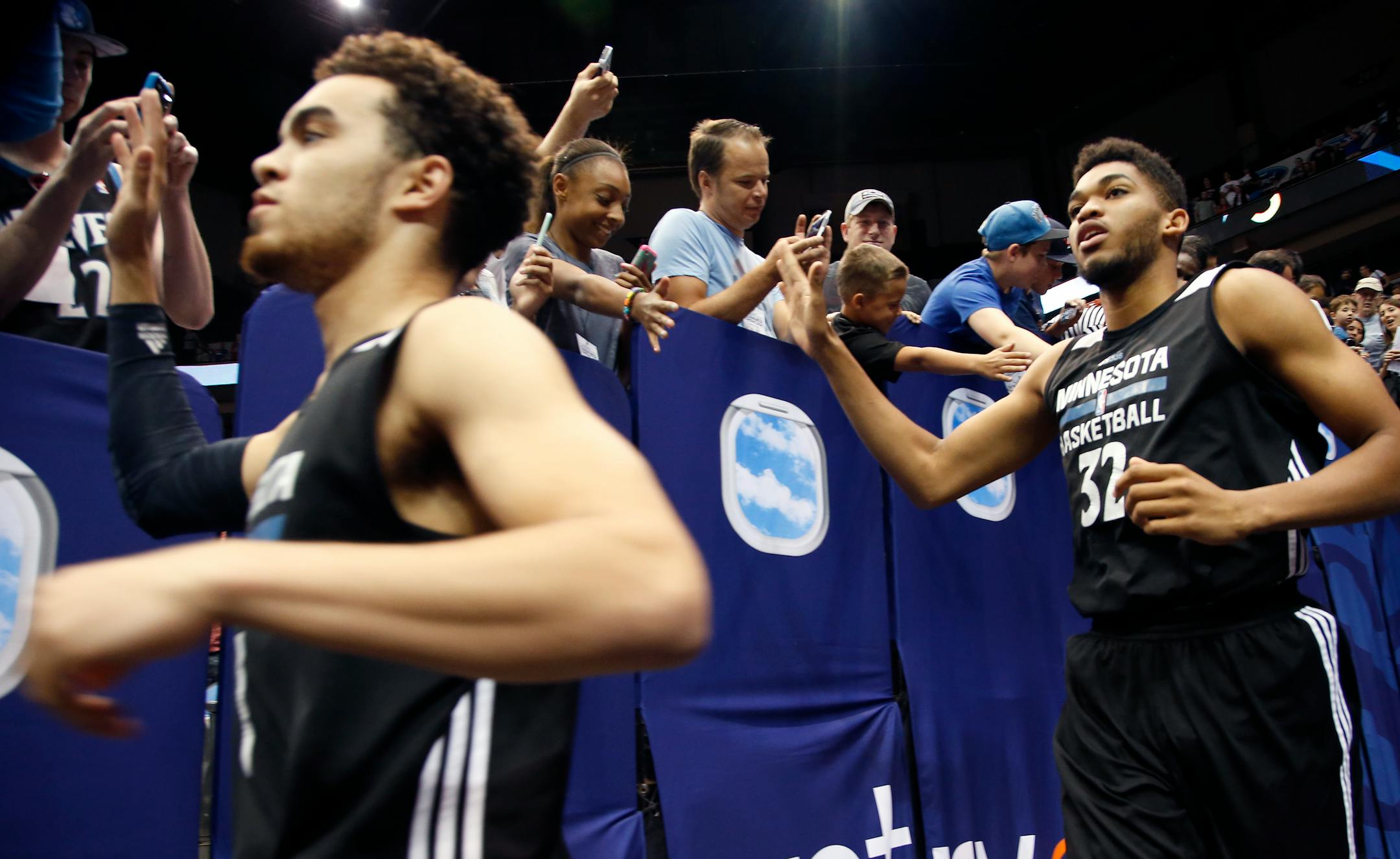 Minnesota Timberwolves first round draft picks Karl-Anthony Towns and Tyus Jones ran onto the court before a team scrimmage at Target Center. ] CARLOS GONZALEZ cgonzalez@startribune.com - July 8, 2015, Minneapolis, MN, Target Center, NBA, Minnesota Timberwolves, Wolves host open scrimmage