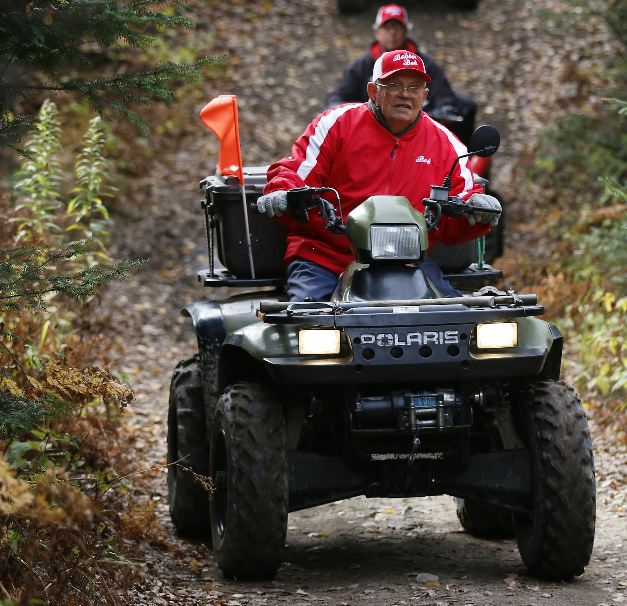 For over 30 years "Bobber" Bob Reed of Cotton has been leading a group of retired ATV enthusiasts on a trail ride every Tuesday. The group that gathers at the Wilbert Cafe in Cotton at 7 a.m., can range from a half dozen to over 30 riders. On this day in 2013, there were a dozen, the youngest, Bob Brown, 65 of Pike Lake, MN, the oldest, the "fearless leader" Bob Reed at 87. Here, Bob Reed (front) leads the group along the Chisholm ATV Trail in 2013. ] BRIAN PETERSON ï brian.peterson@startri