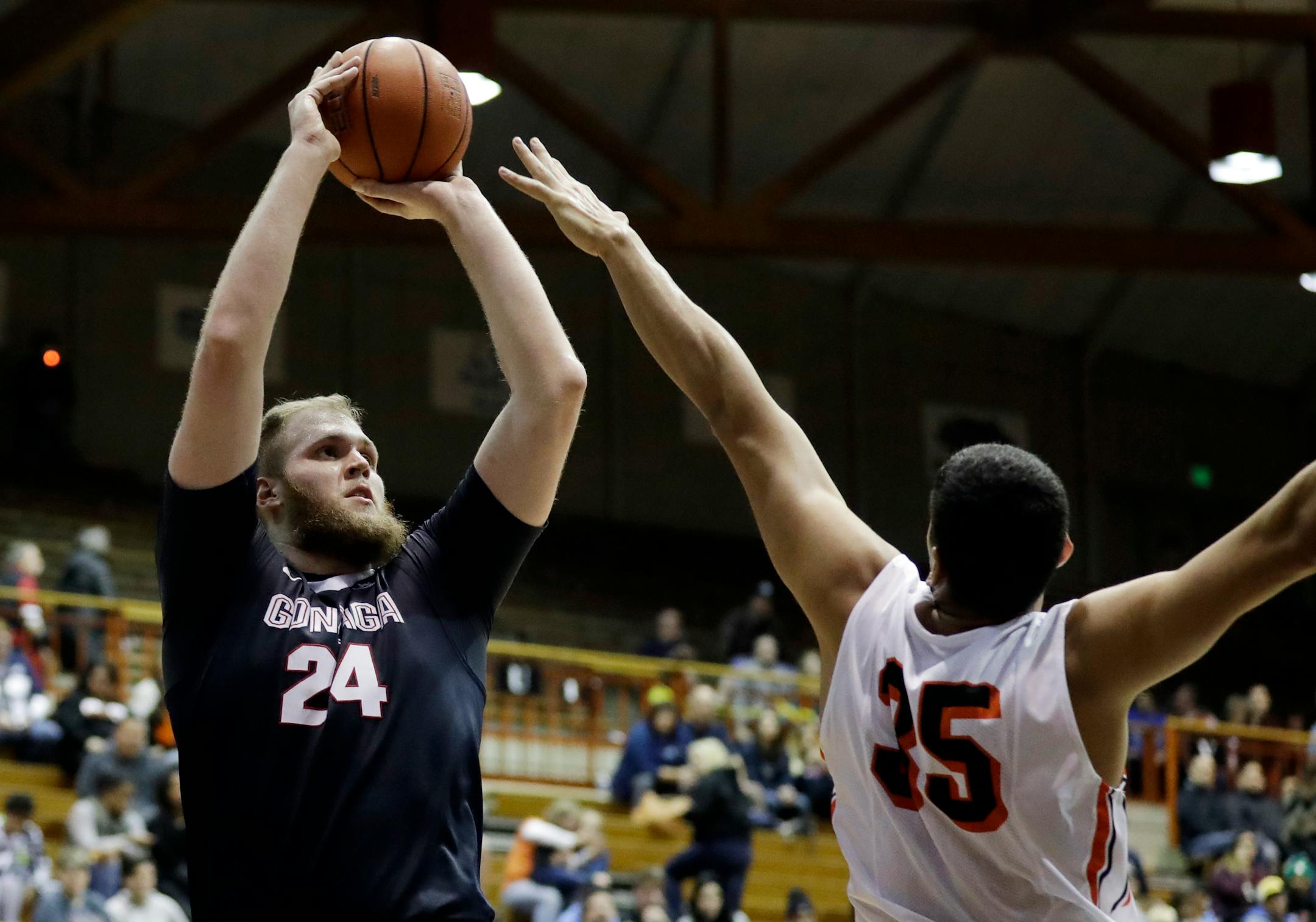 Gonzaga's Przemek Karnowski (24) shoots over Pacific's Sami Eleraky (35) during the second half of an NCAA basketball game Saturday, Dec. 31, 2016, in Stockton, Calif. Gonzaga won 81-61.