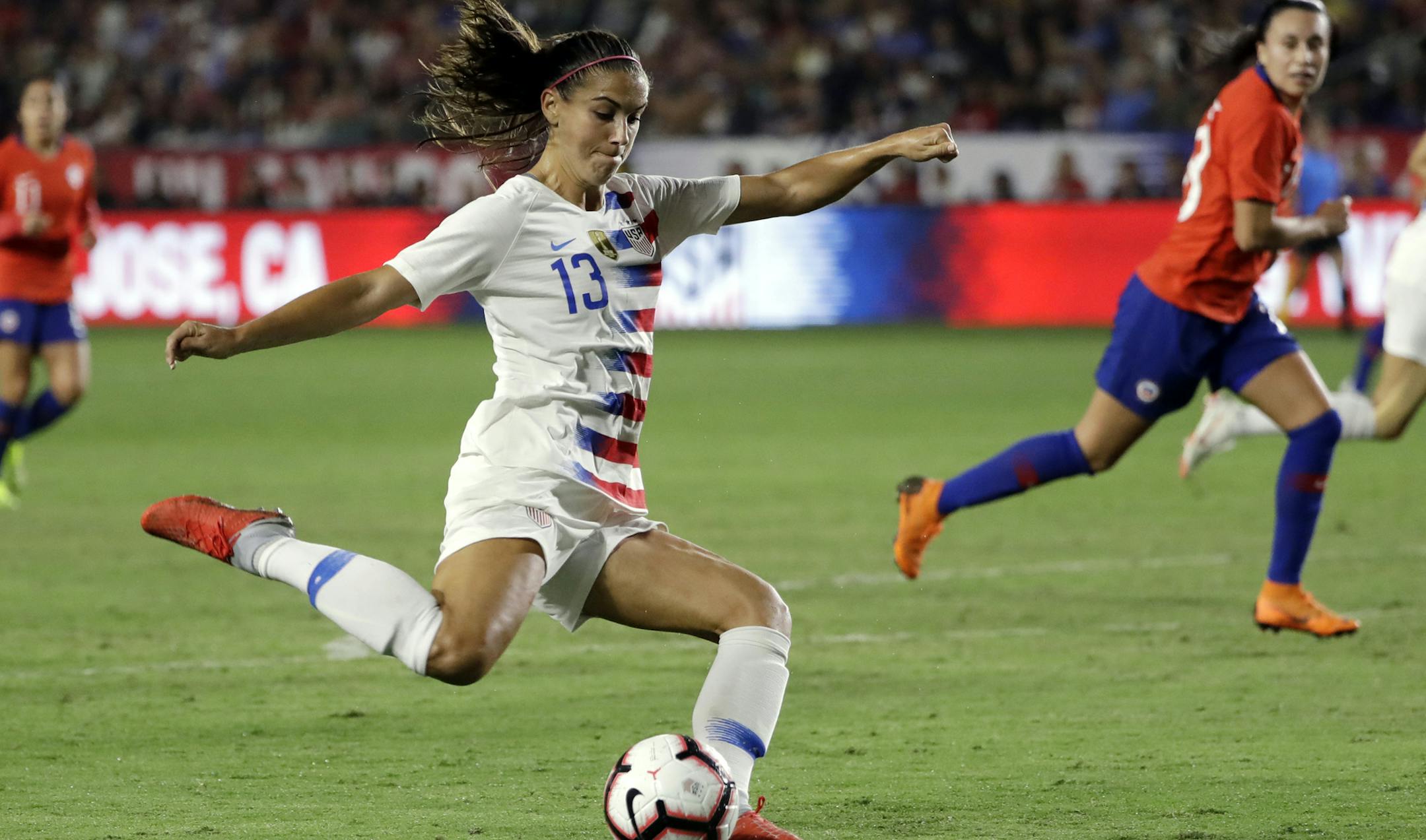 FILE - In this Aug. 31, 2018, file photo, United States' Alex Morgan shoots on goal against Chile during the first half of an international friendly soccer match, in Carson, Calif. Two goals away from reaching 100 for her career, forward Morgan is on the roster for the U.S. women's national team as it opens training camp ahead of the World Cup in France this summer. (AP Photo/Marcio Jose Sanchez, File)