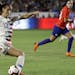 FILE - In this Aug. 31, 2018, file photo, United States' Alex Morgan shoots on goal against Chile during the first half of an international friendly s