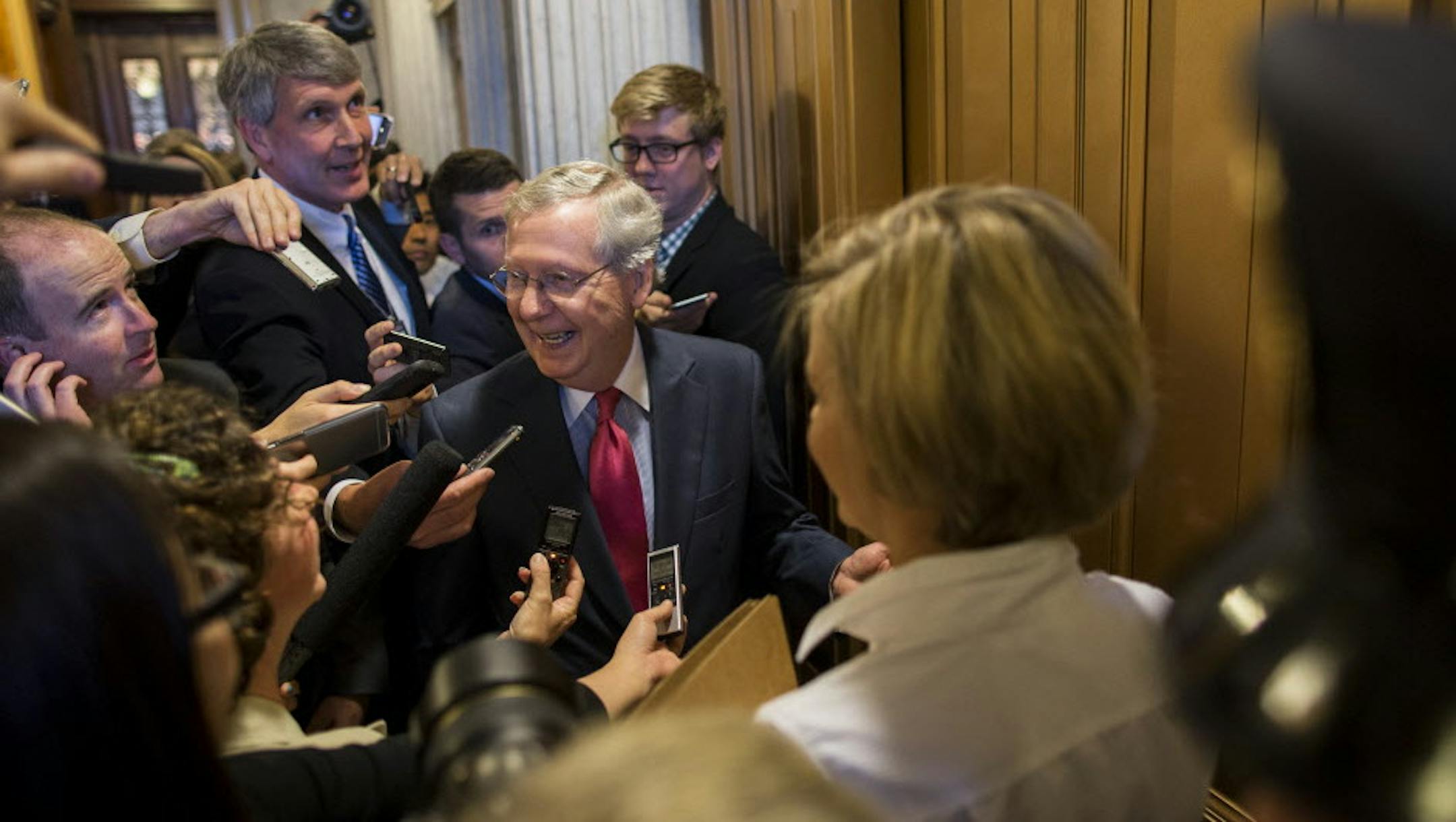 Senate Majority Leader Mitch McConnell speaks to reporters following the cloture vote on the Trade Bill on Capitol Hill in Washington, May 21, 2015. The Senate on Thursday voted to break a filibuster to advance legislation that would empower President Barack Obama to complete a major Pacific trade agreement. (Zach Gibson/The New York Times)