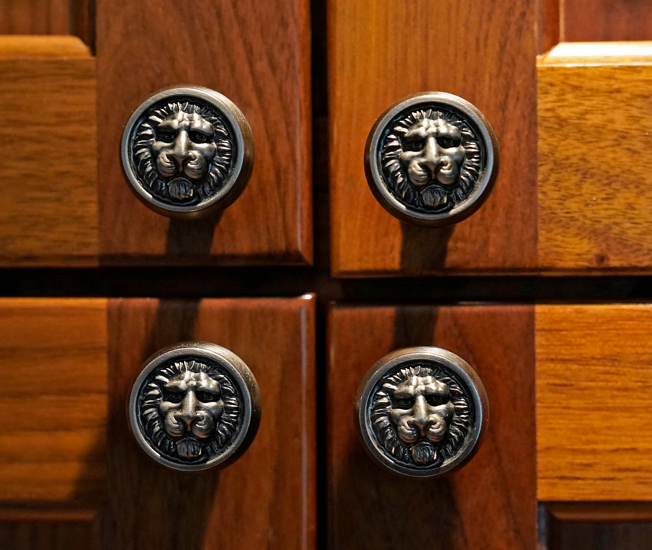Details of lion hardware on walnut cabinets, which was handpicked by the Lines for the recording studio.