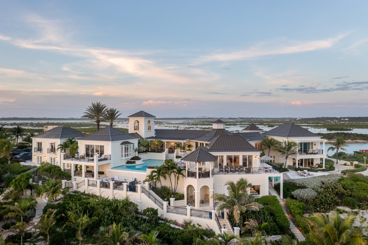 Tom Barnes, the 54-year-old owner of a Charlotte-based private equity firm, has begun leasing stays at a two-mansion property he owns in Turks &amp; Caicos, the group of tropical islands about 575 miles southeast of Miami. The late rock and roll Hall of Famer Prince once owned one of the mansions, which Barnes bought in 2019. Barnes also bought the mansion next door to the former Prince mansion in 2021 and began leasing both in January 2022, after he and his wife, Sharon, served as general contractors on millions of dollars in renovations to the mansions. A night's stay ranges from $12,000 to $36,000, depending on the season and whether both mansions are leased or just one. (Sean Brady/Emara Properties/TNS) ORG XMIT: 40751930W