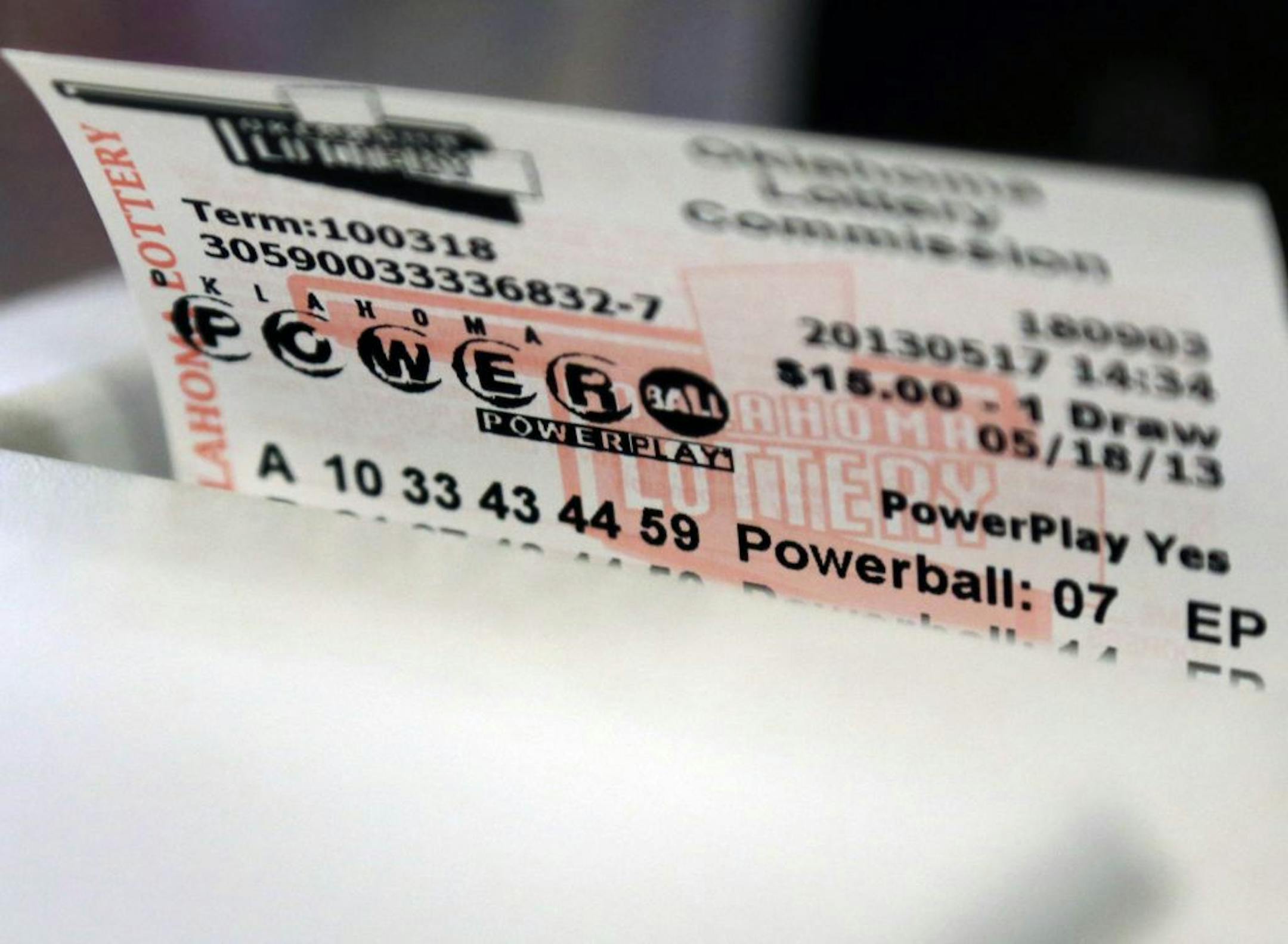 A Powerball Lottery ticket is dispensed from a machine in Oklahoma City, Friday, May 17, 2013. Powerball officials say the jackpot has climbed to an estimated $600 million, making it the largest prize in the game's history and the world's second largest lottery prize.