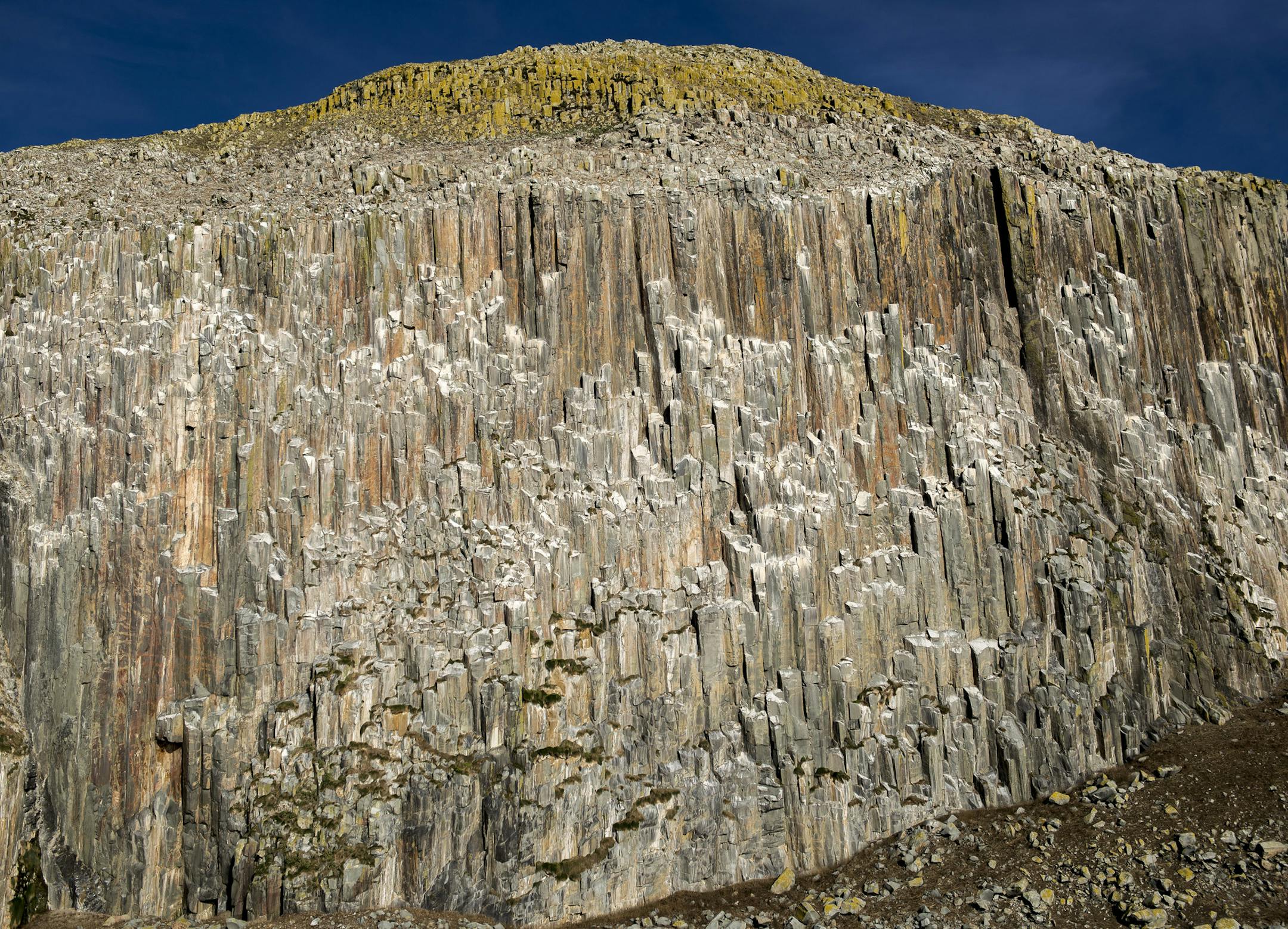 Rock formations on The southwest side of Ailsa Craig, off the coast of Scotland, Nov. 10, 2013. The uninhabited 200-acre island is the source of a distinctive granite used to make Olympic curling stones and has been owned by the same family for 500 years, but now is for sale for $2.4 million. (Andrew Testa/The New York Times)
