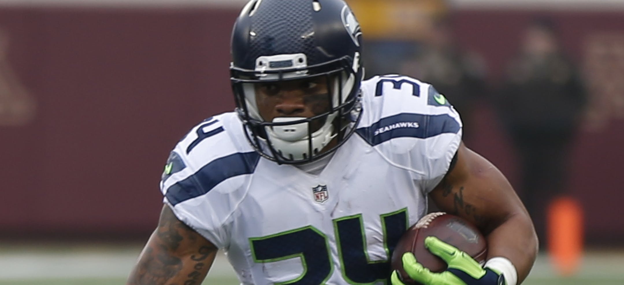 Seattle Seahawks running back Thomas Rawls (34) runs against the Minnesota Vikings in the first half of an NFL football game Sunday, Dec. 6, 2015 in Minneapolis. (AP Photo/Jim Mone)